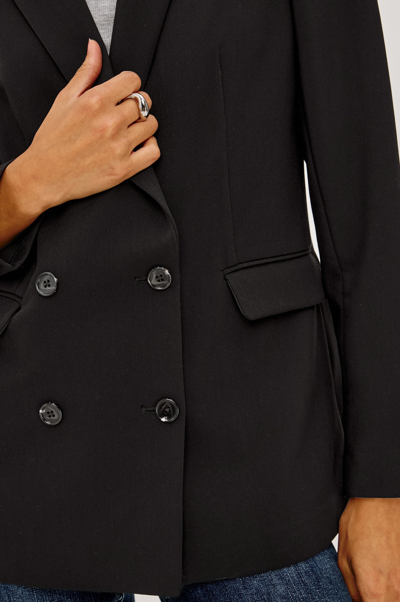 Jac Blazer in Wool Blend With Double-Breasted Design, Notched Lapels, Long Sleeves, Side Flap Pockets, and Fully Lined in Black Colorway - Mid Body Front View Featured on Model