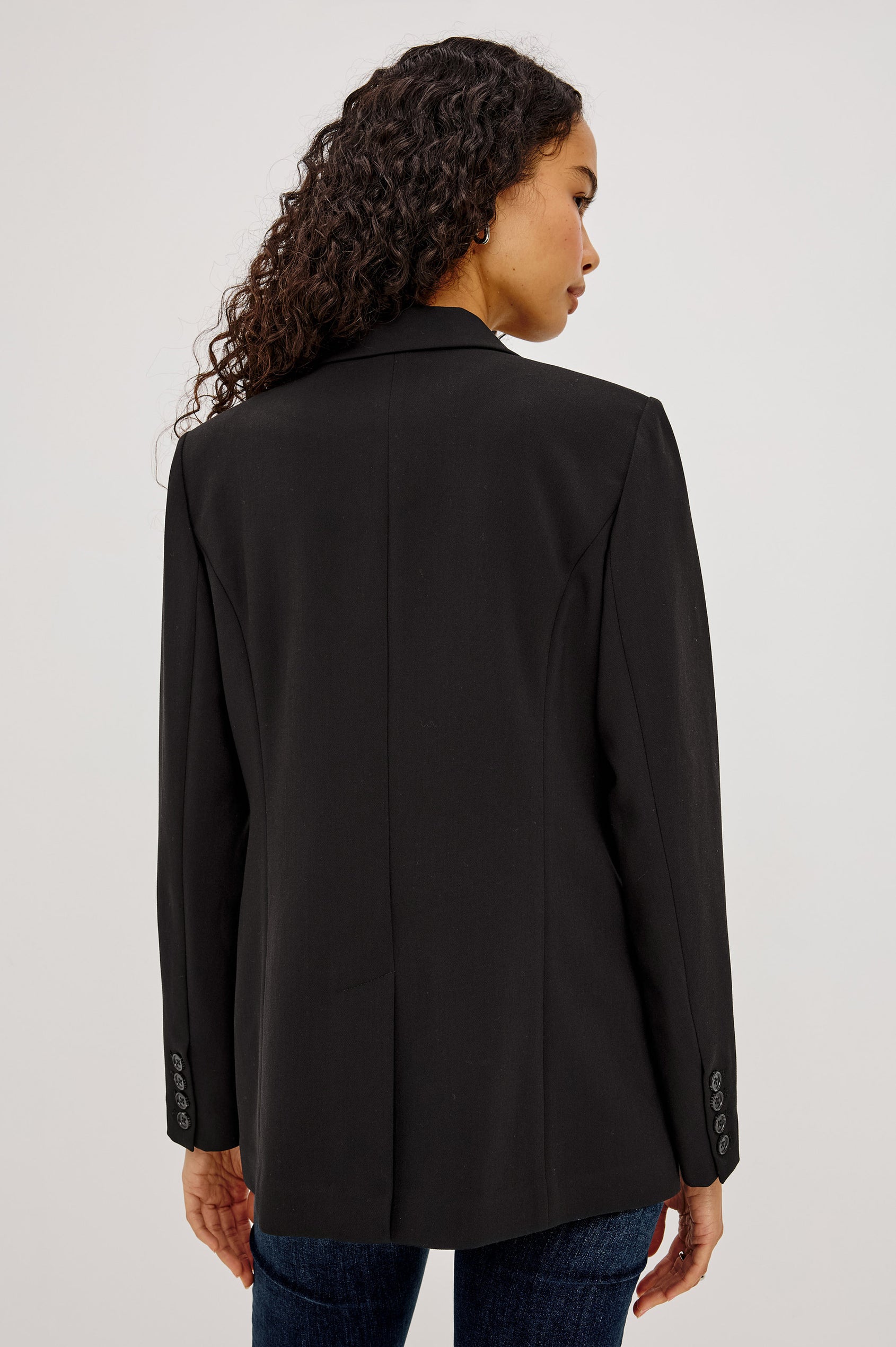 Jac Blazer in Wool Blend With Double-Breasted Design, Notched Lapels, Long Sleeves, Side Flap Pockets, and Fully Lined in Black Colorway - Upper Body Back View Featured on Model