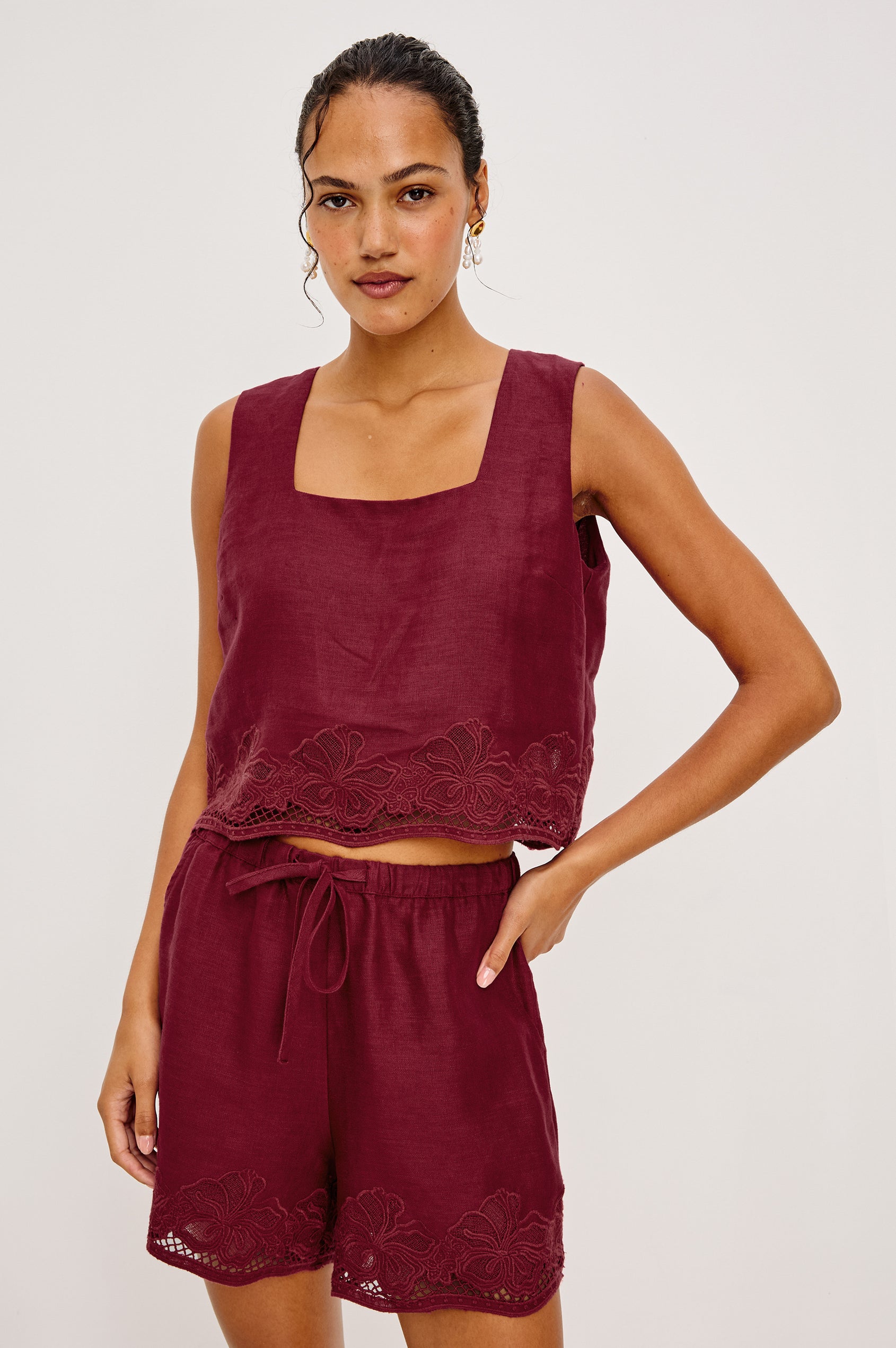 Jenner High-Waisted Short in Unlined Linen With Adjsutable Drawstring Waist TIes Side Pockets and Relaxed Fit in Berry Hibiscus Embroidery Colorway - Lower Body Front View Featured on Model