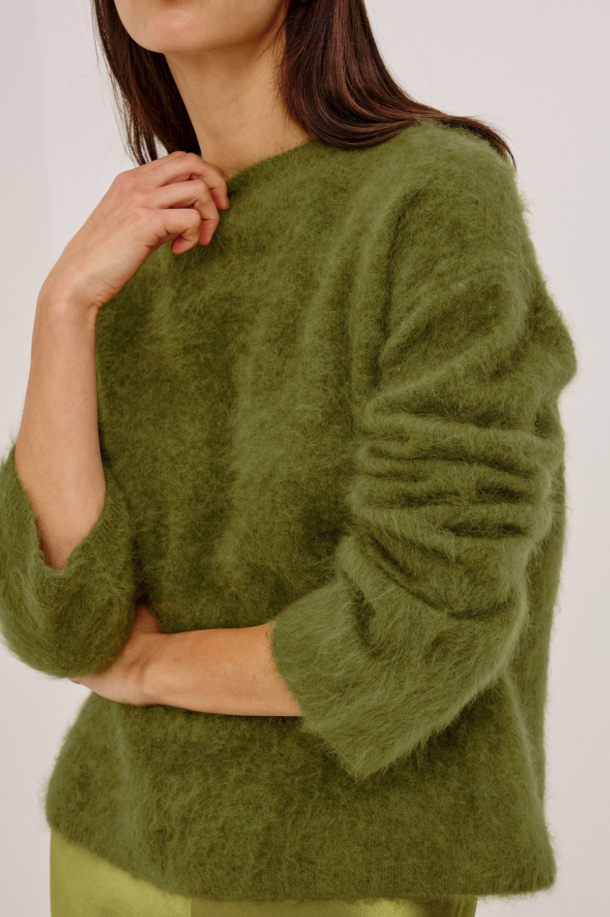Joel Sweater in Brushed Wool With Oversized Boxy Relaxed Fit, Drop Shoulders, and Mock Neckline in Celery Colorway - Upper Body Front Detail View Featured on Model.