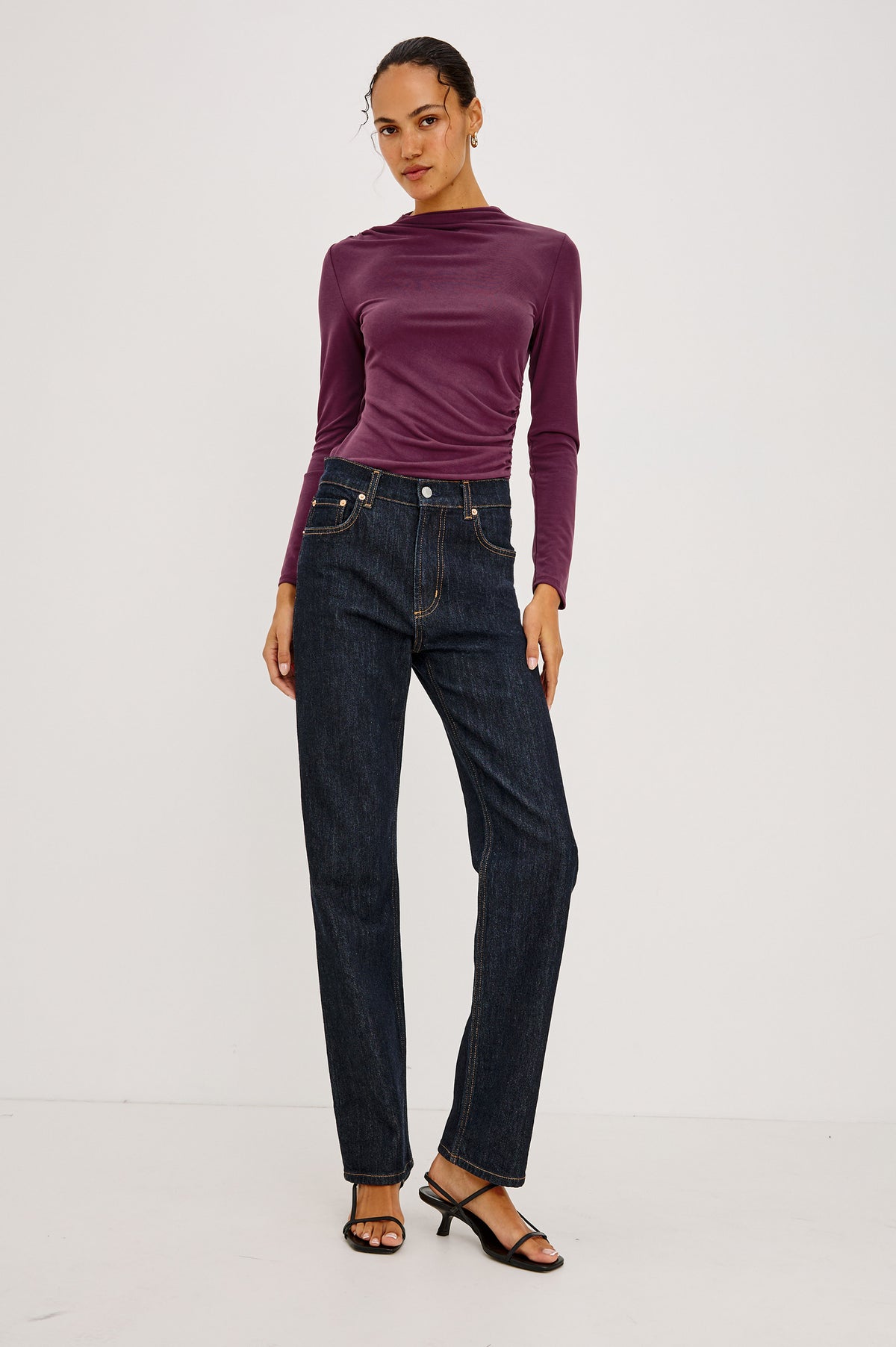 Joelle Top in Brushed Jersey With Draped Mock Neck, Shirring at Shoulder and Side, Long Sleeves, and Fitted Silhouette in Wine Colorway - Full Body Front View Featured on Model.