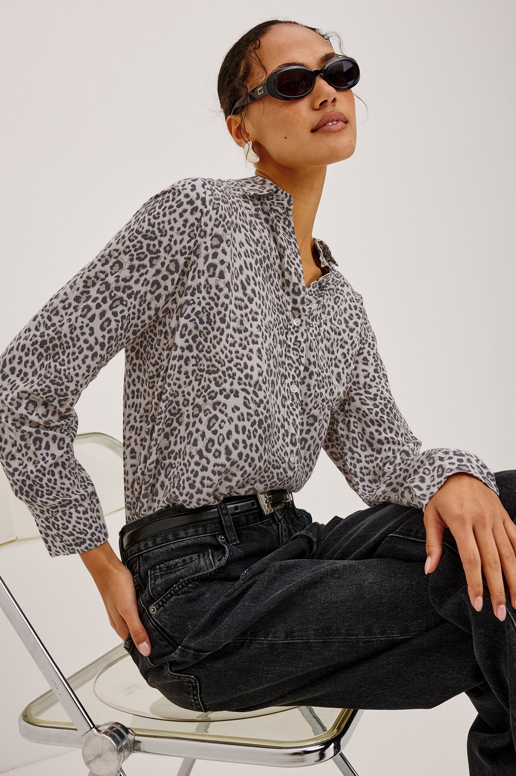 Josephine Shirt in Featherweight Rayon With Relaxed Fit, Collar, and Button Front in Ecru Cheetah Colorway - Upper Body Side View Featured on Model Sitting