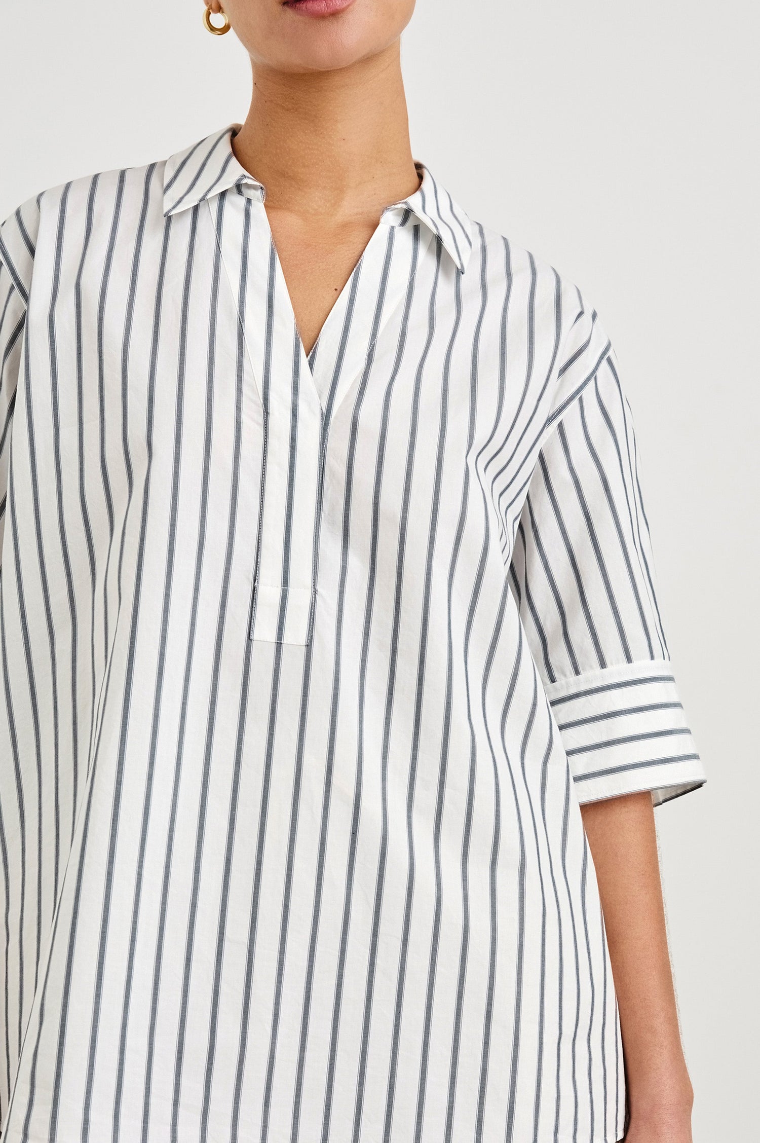 Juda 3/4 Sleeve Top With Front Placket And Collar In Colorway Chalk Slate Stripe - close up of details on model