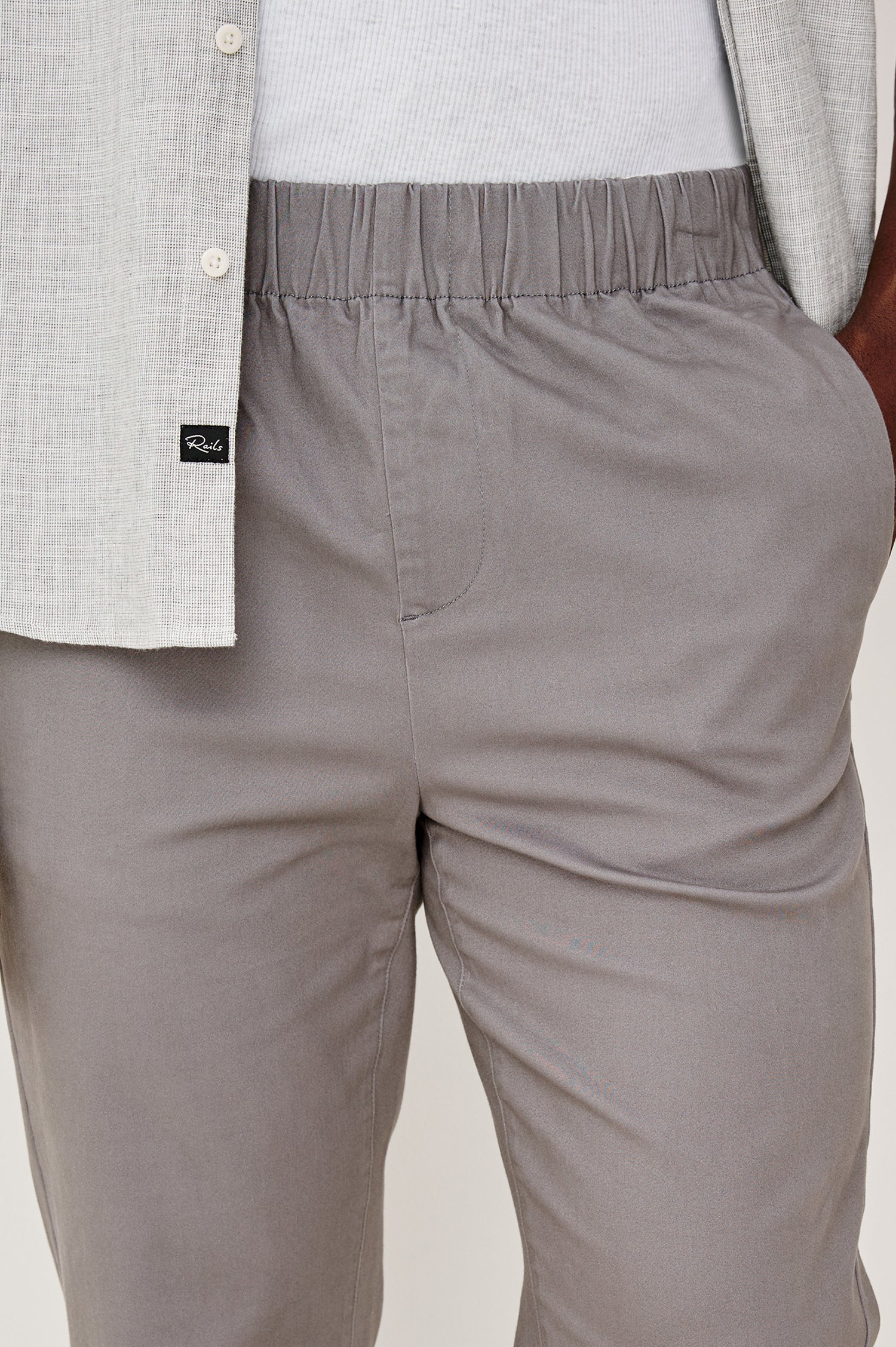 Julian Pants with an Elastic Waist, Two Front Pockets and Two Back Welt Pockets in Concrete Colorway - Front Detail View Featured on Model