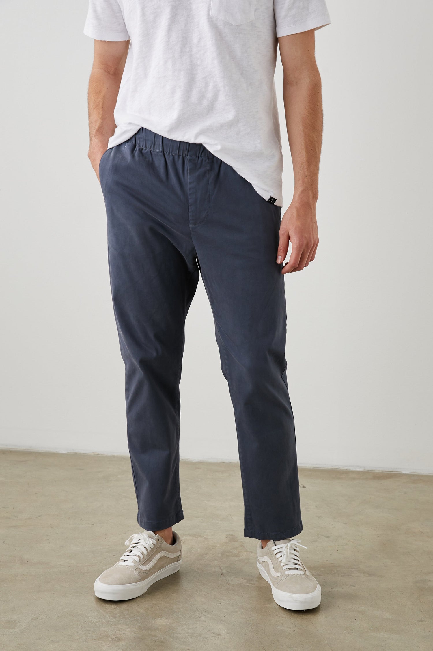  Julian Pants with an Elastic Waist, Two Front Pockets and Two Back Welt Pockets in Faded Blue Colorway - Front View Featured on Model 