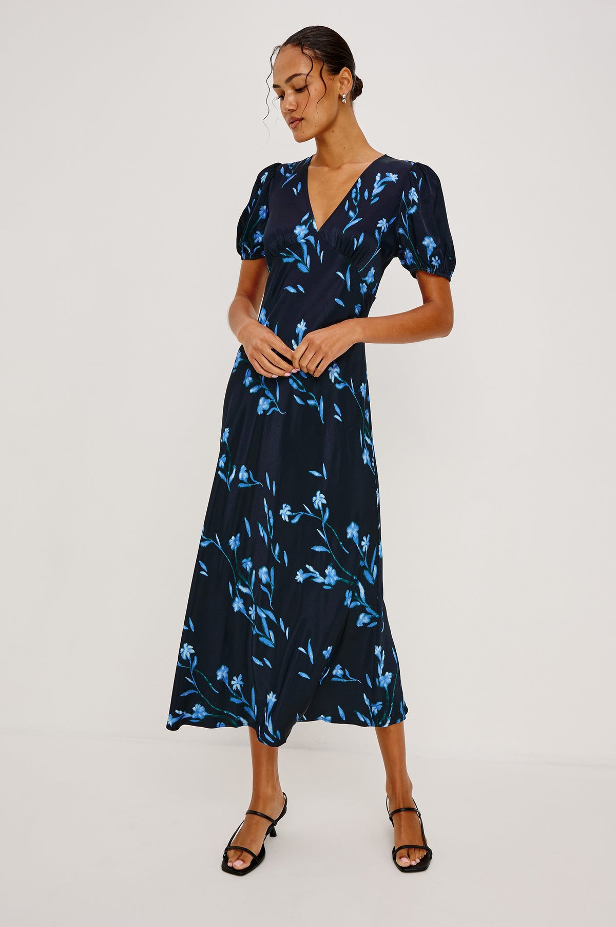 Junia Midi Dress in Satin Back Crepe With V-Neckline, Short Puff Sleeves, and Slip-on Design in Blue Carnation Colorway - Upper Body Front View Featured on Model