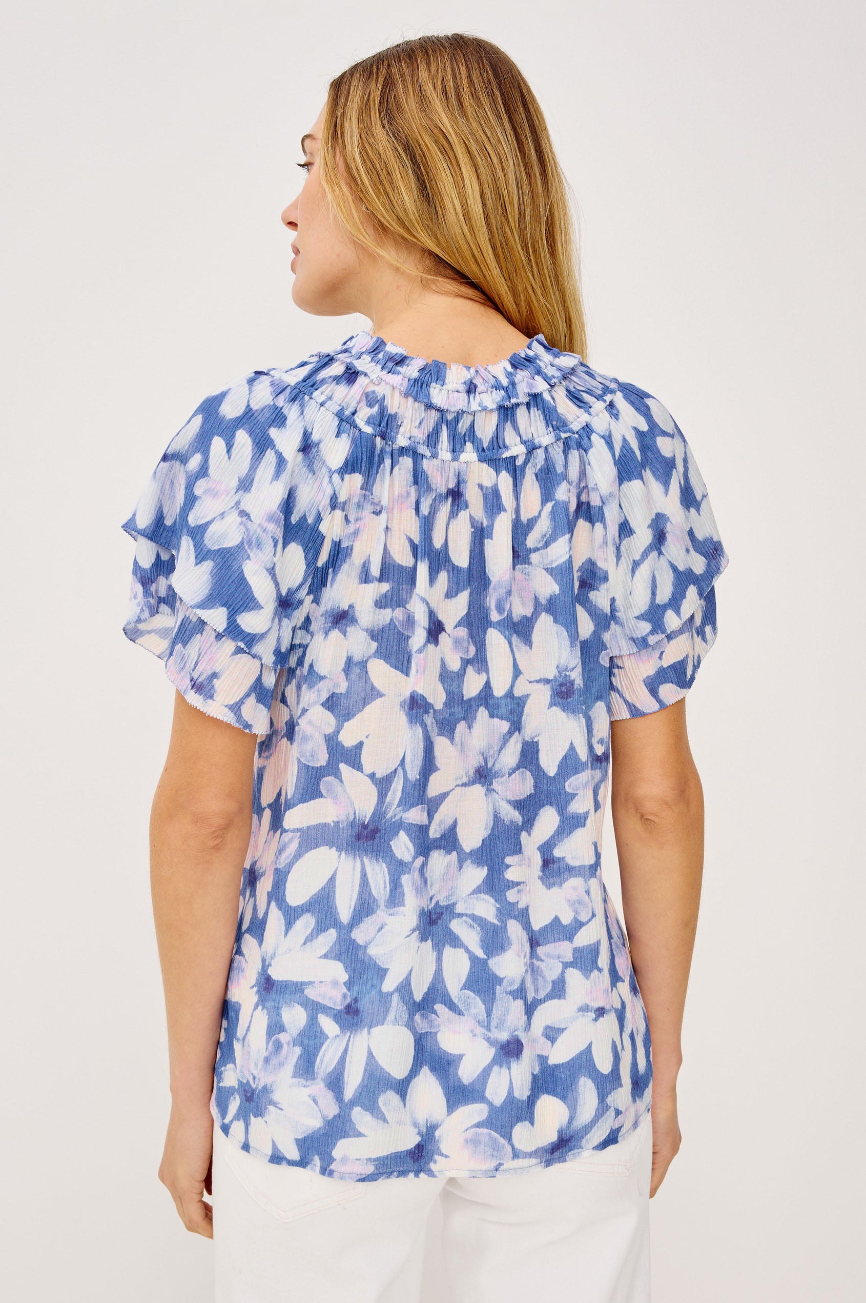 Kamila Top in Chiffon With Elastic Ruffle Collar, V-Neck, and Tiered Flutter Sleeves in Blue Amaranth Colorway - Upper Body Back View Featured on Model