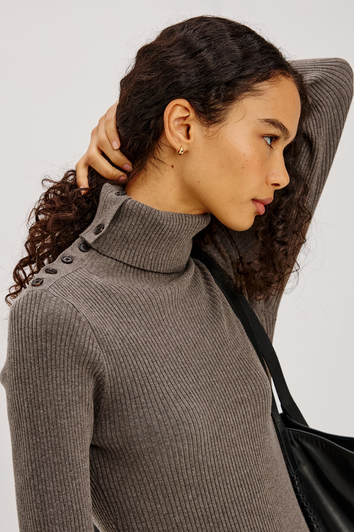 Kat Maxi Dress in Ribbed Cotton Blend With Foldover Turtleneck Button Neckline, Long Sleeves, Fitted Silhouette, Long Sleeves, Side Placket, and Subtle Flare at Hem in Hazelnut Colorway - Upper Body Side View Featured on Model