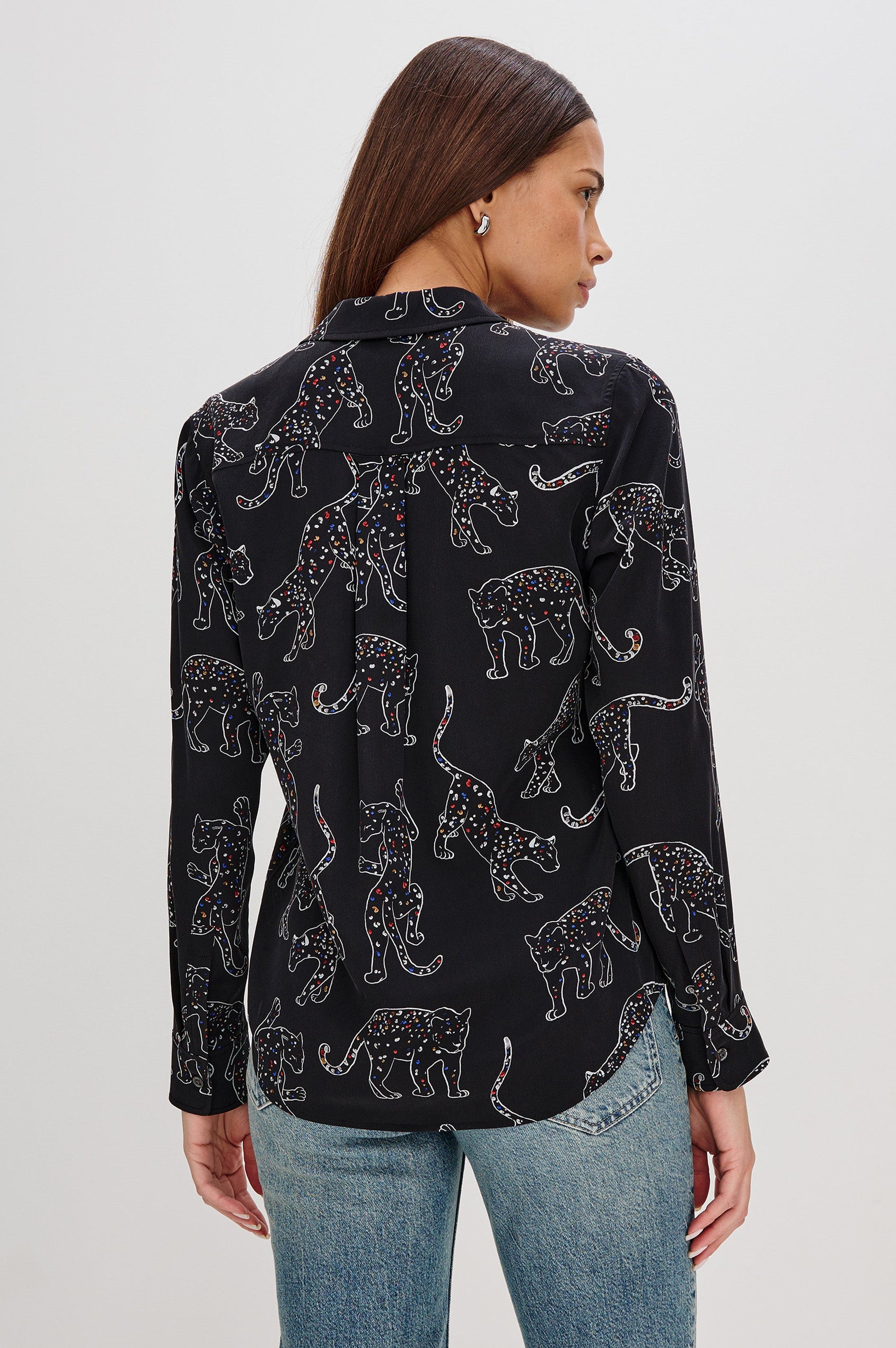Washed silk button-down shirt in ivory with a horse print. The shirt has a soft drape and classic collar for a polished look. Back View on Model.