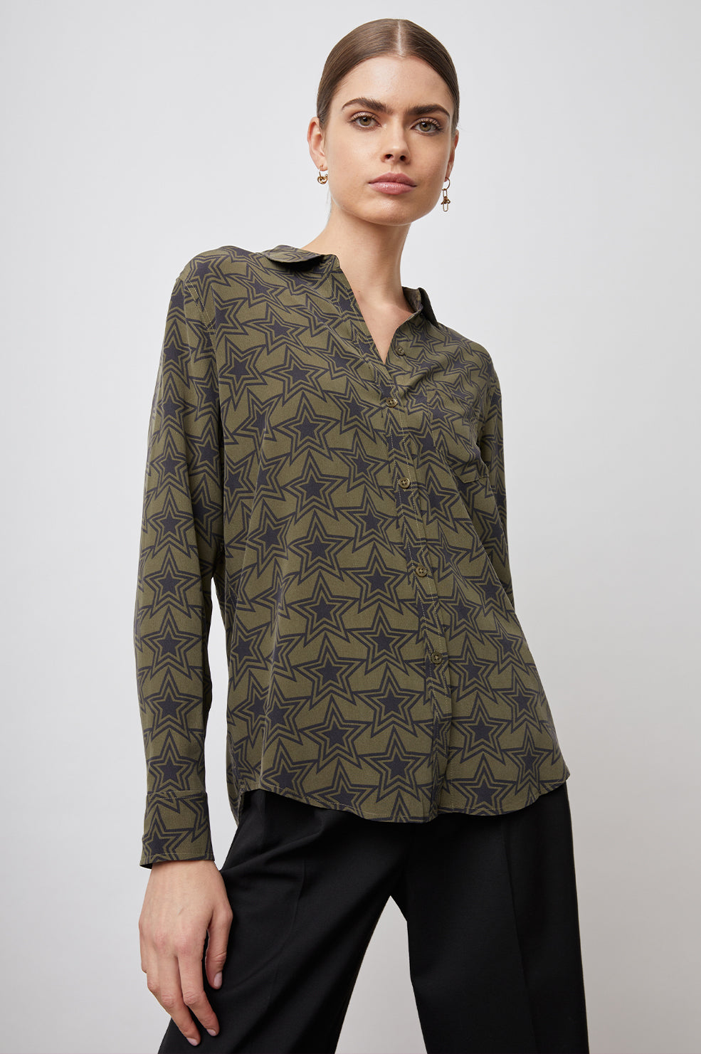 Kate Long Sleeve Button up with a Chest Patch Pocket in Olive Stargaze Colorway, Black Stars on Olive  - Front View Featured on Model