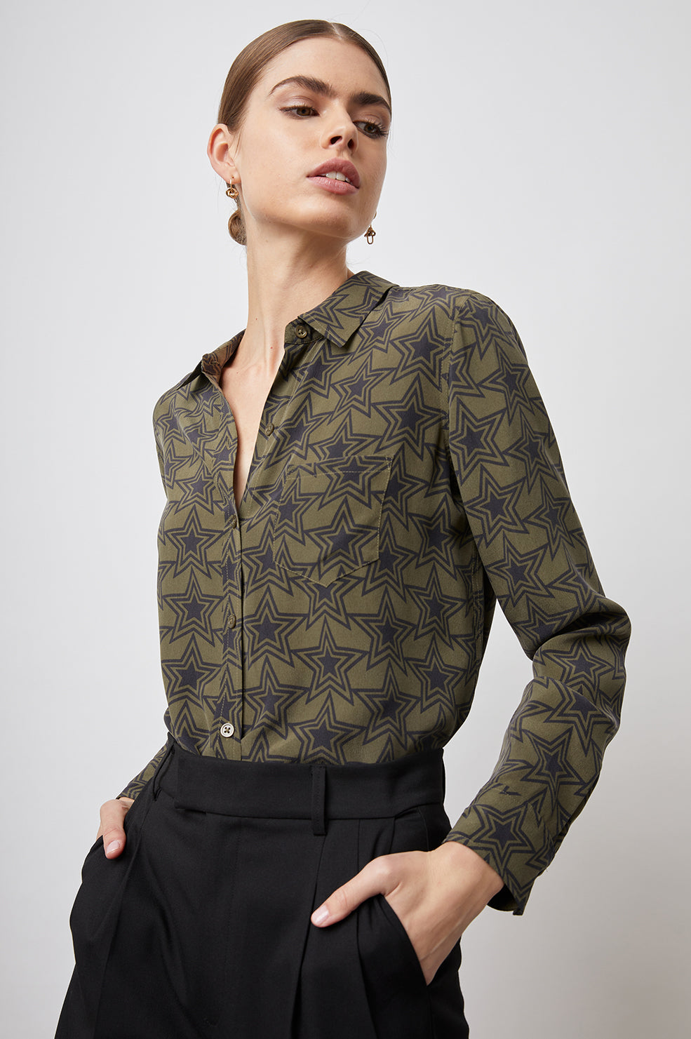 Kate Long Sleeve Button up with a Chest Patch Pocket in Olive Stargaze Colorway, Black Stars on Olive  - Front Tucked View Featured on Model