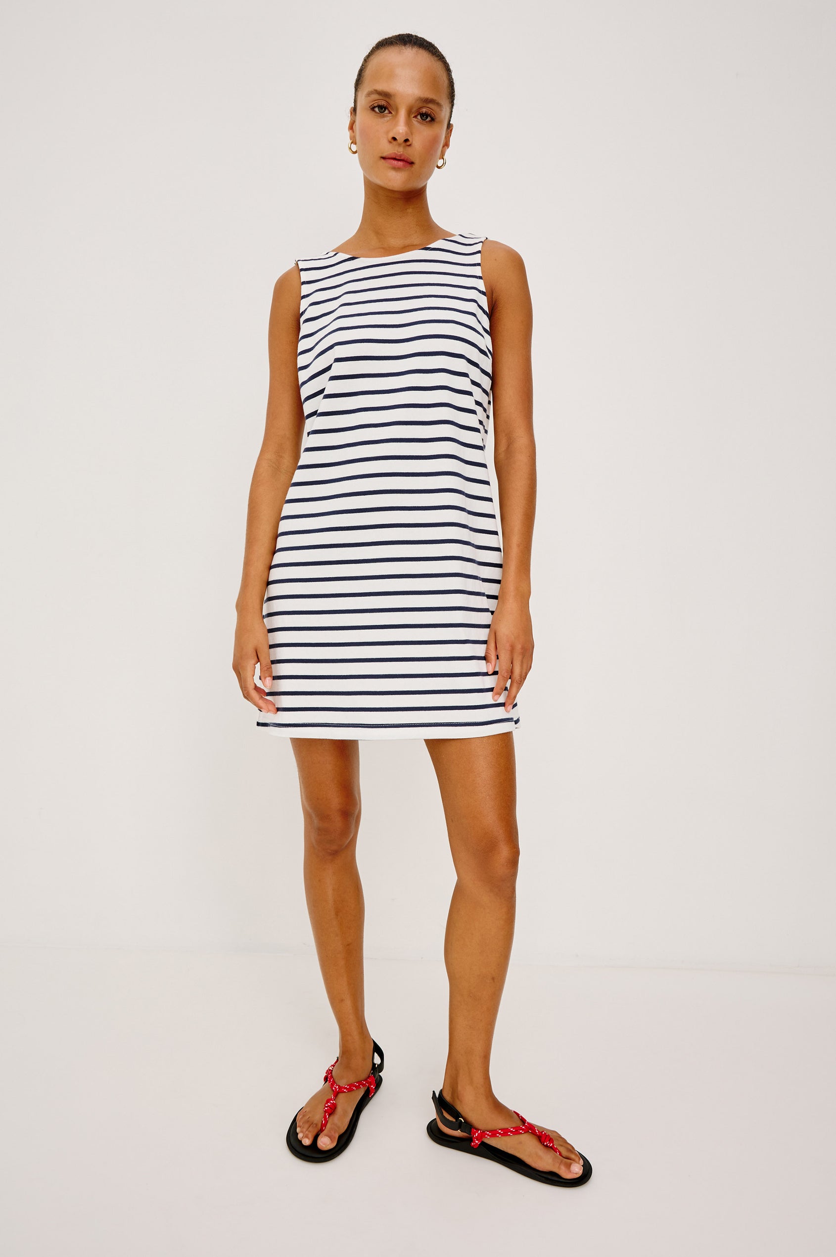Kaylee Mini Dress in Cotton Jersey With Boat Neckline, A-Line Silhouette, and Scoop Back in Ivory Navy Stripe Colorway - Full Body Front View Featured on Model