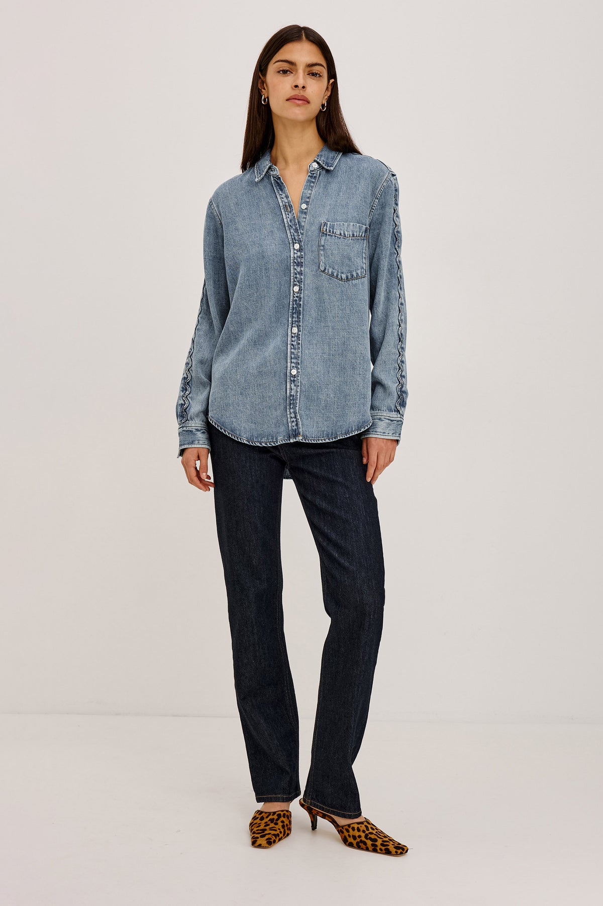 Kellan Shirt in TENCEL™ Denim With Relaxed Fit, Chest Patch Pocket, Zig-Zag Trim at Long Sleeves, Front Buttons, and Shirttail Hem in Mid Blue Colorway - Full Body Front View Featured on Model.