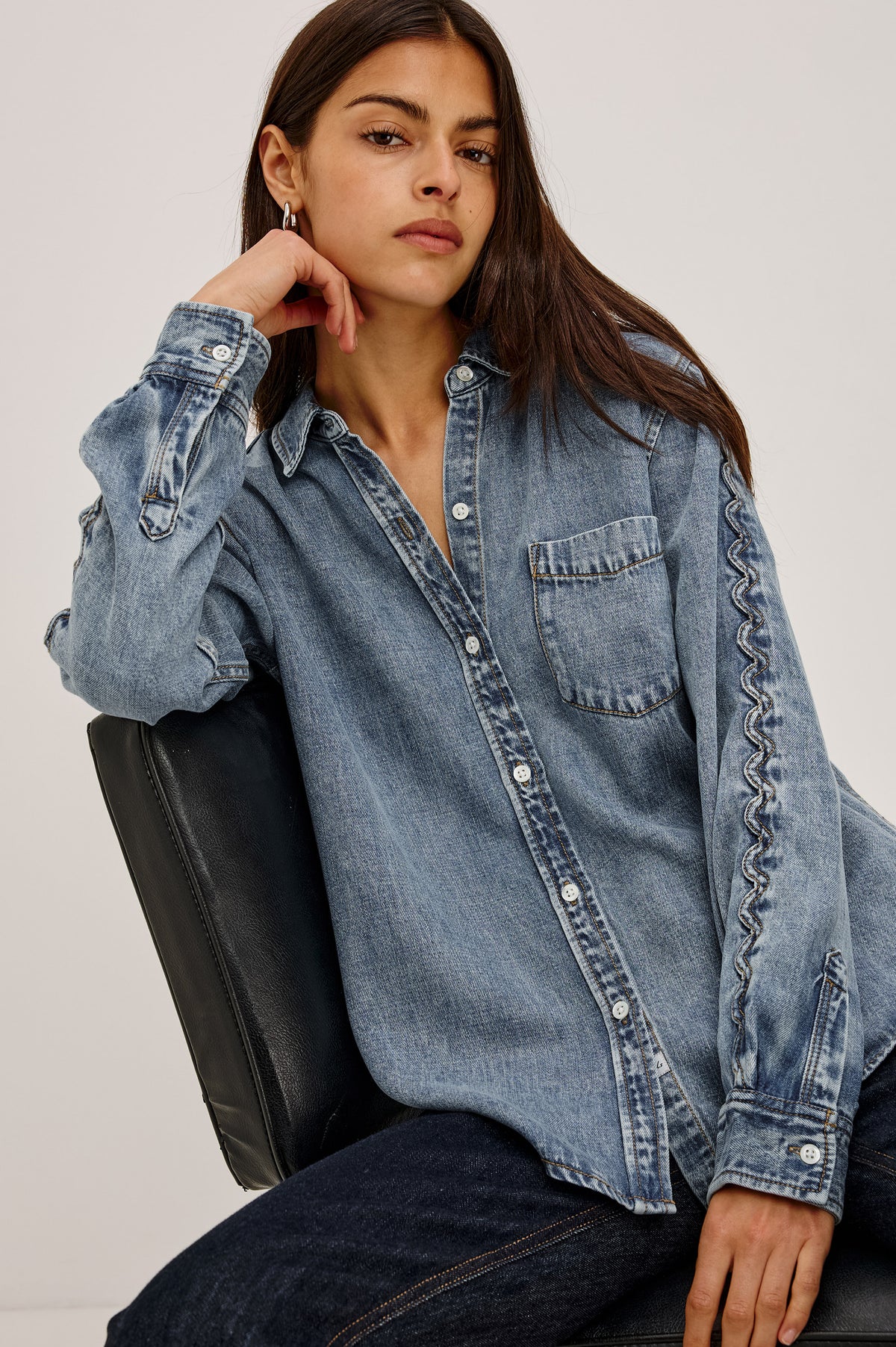 Kellan Shirt in TENCEL™ Denim With Relaxed Fit, Chest Patch Pocket, Zig-Zag Trim at Long Sleeves, Front Buttons, and Shirttail Hem in Mid Blue Colorway - Front View Featured on Model.
