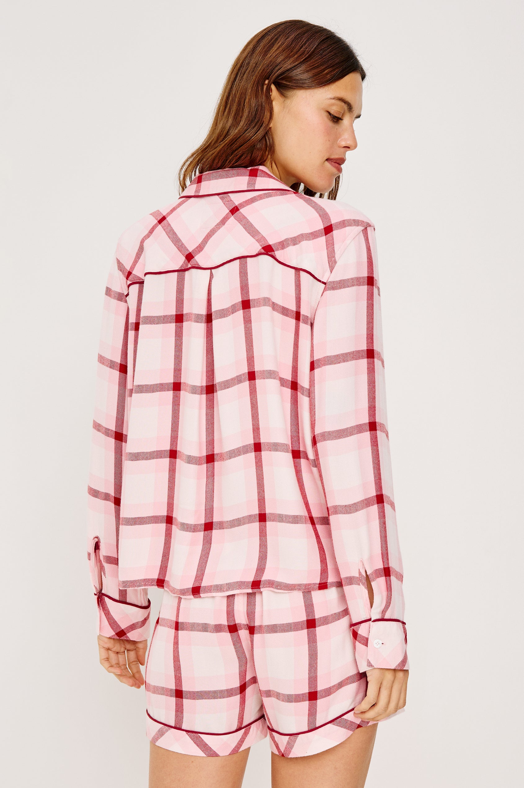 Kellen Pajama Set in Signature Rayon With Relaxed Long Sleeve Button-Up Shirt With Notched Collar and Matching High-Waisted Shorts With Adjustable Drawstring Ties in Pink Cherry Plaid Colorway - Upper Body Back View Featured on Model
