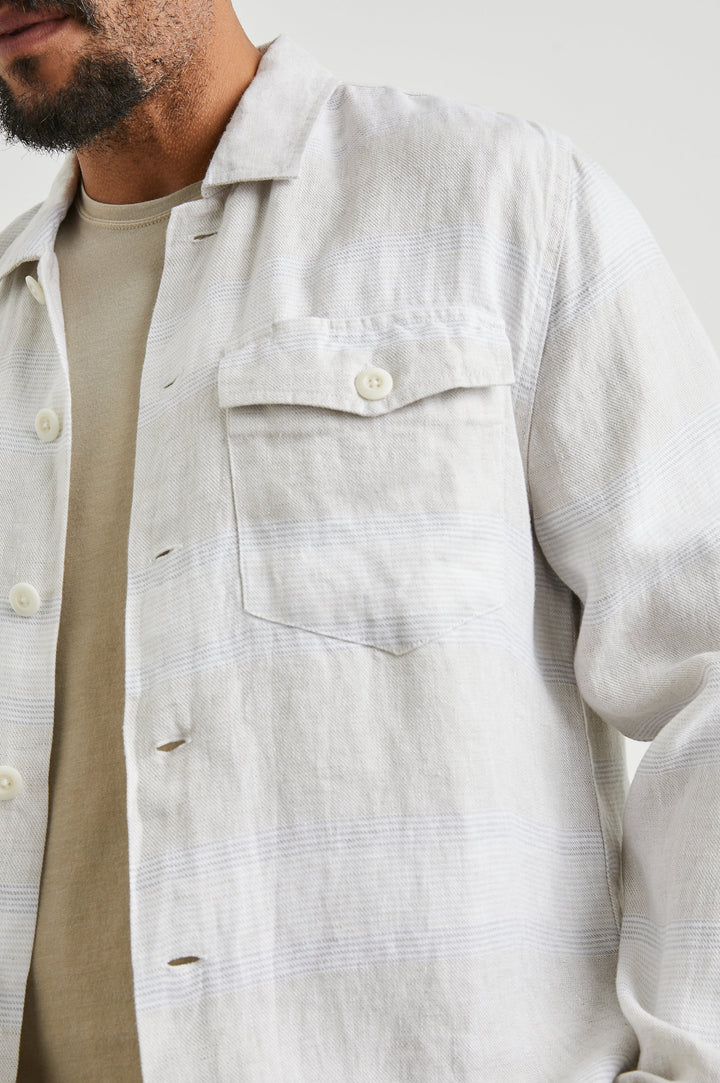 Kerouac Long-Sleeve Shirt Jacket with Button Closure and Two Button Chest Flap Pockets in Wicker Graphite Stripe Colorway, Grey and White Horizontal Stripes on Wicker  - Front Unbuttoned View Featured on Model