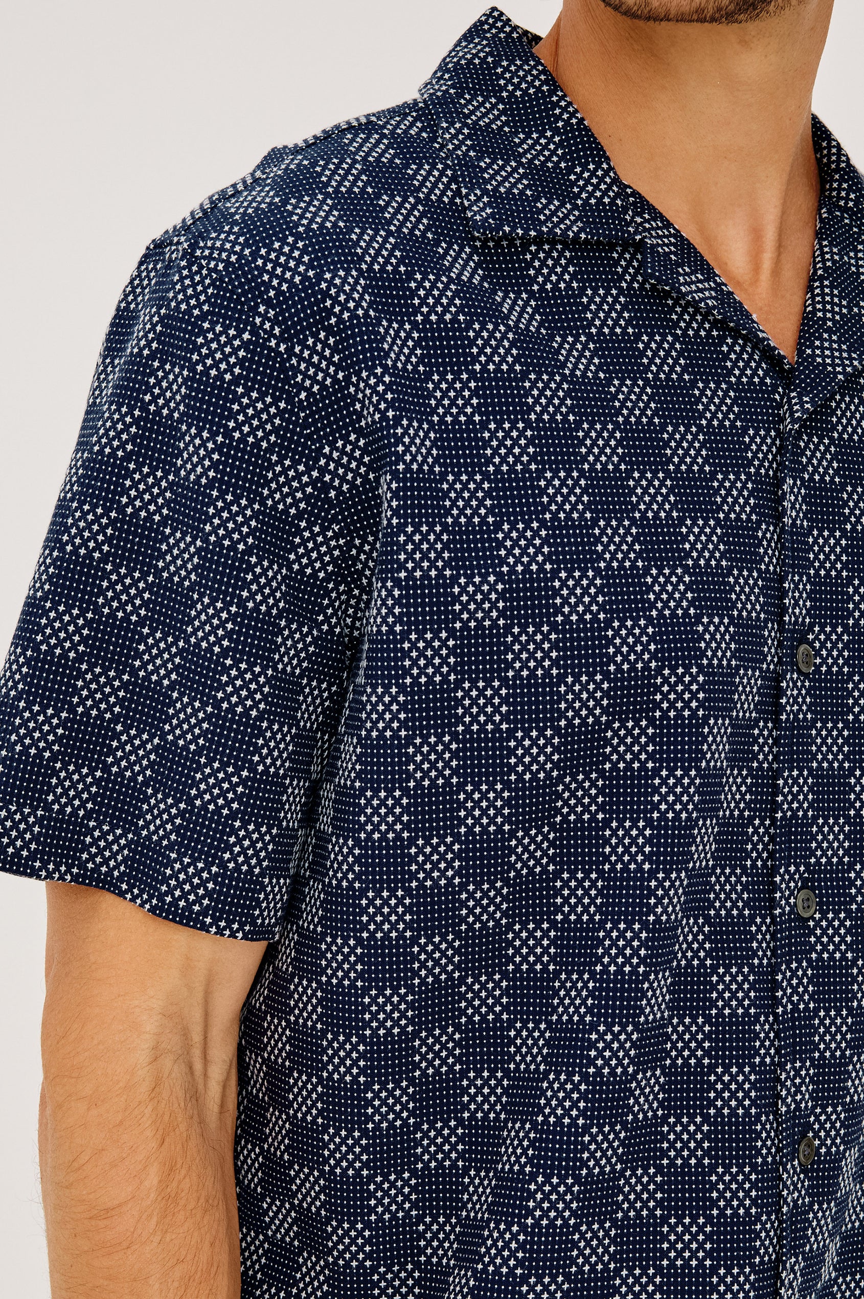 Kin Shirt in Textured Dobby Cotton With Camp Collar, Front Buttons, and Relaxed, Boxy Fit in Navy Sashiko Colorway - Upper Body Close Up View Featured on Model
