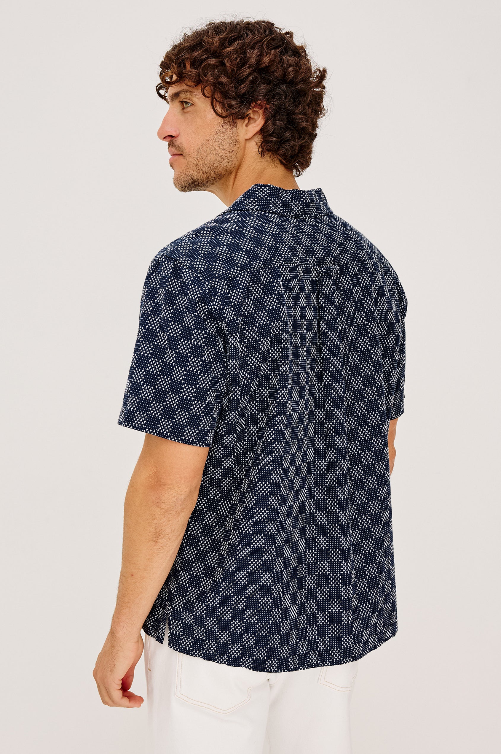 Kin Shirt in Textured Dobby Cotton With Camp Collar, Front Buttons, and Relaxed, Boxy Fit in Navy Sashiko Colorway - Upper Body Back View Featured on Model