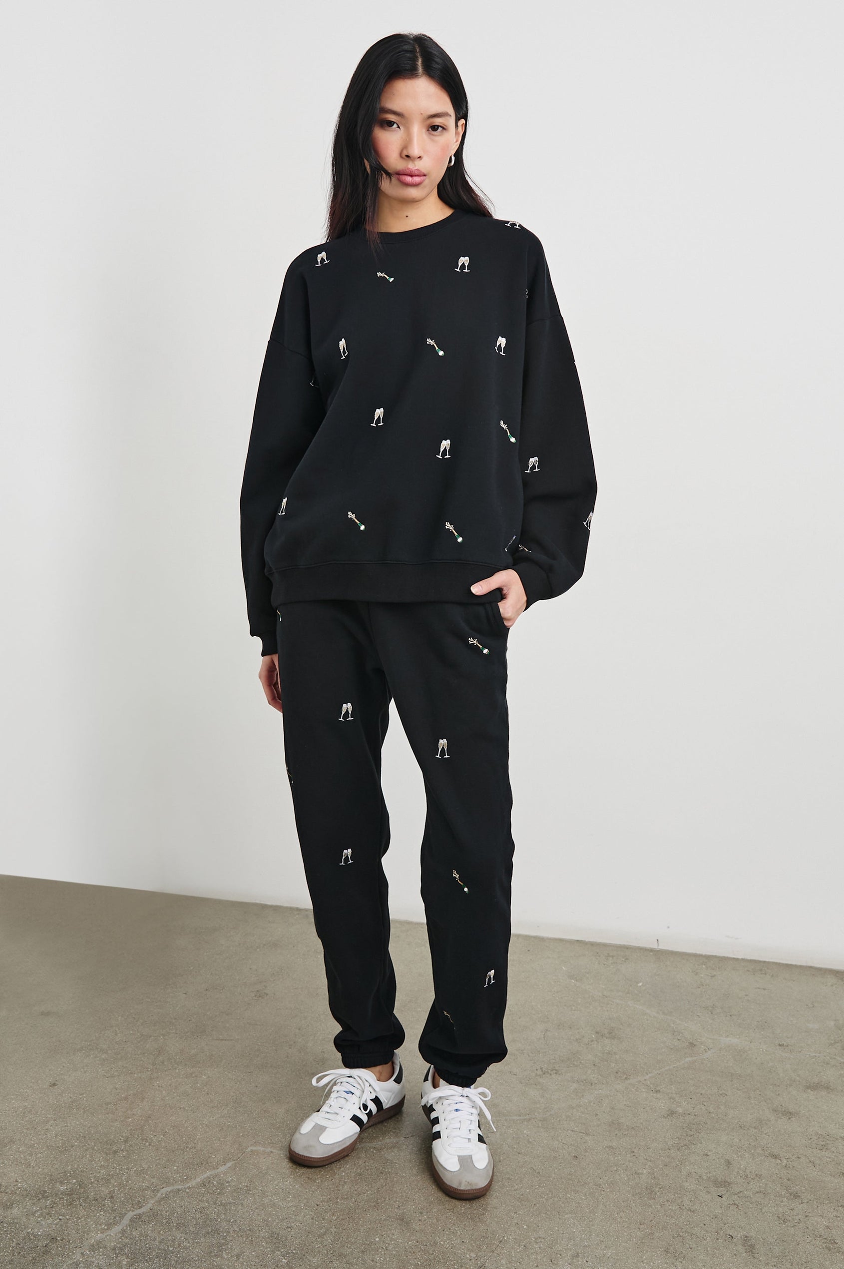 Kingston Pants with Elastic Cuffs and Waist with Drawcord in Black Champagne Embroidery Colorway, Champagne Glasses on Black - Front Full Body View Featured on Model