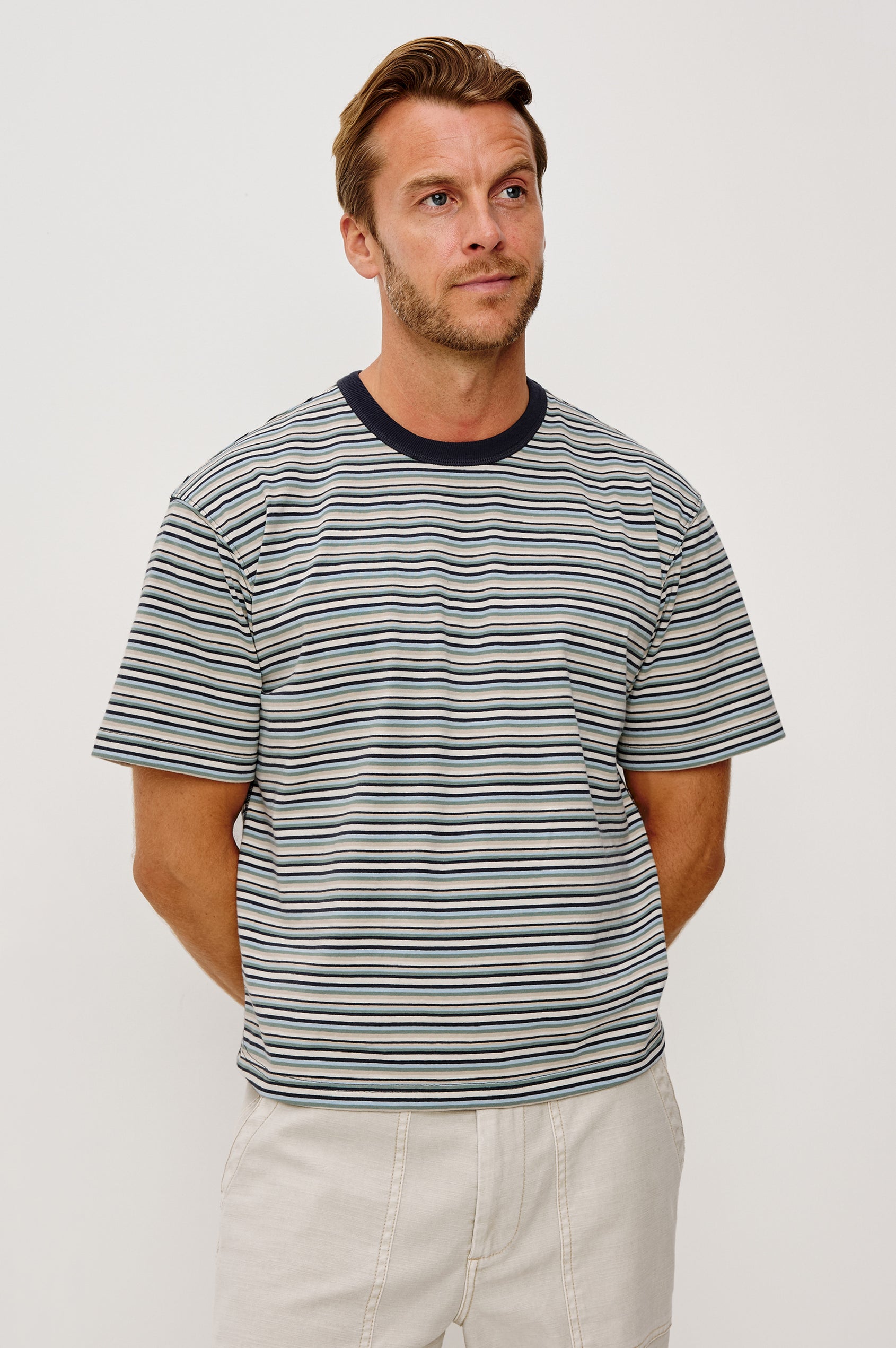 Kip T-Shirt in Relaxed Boxy Fit in Yarn-Dyed Jersey, Contrast Crew Neckline, and Short Sleeves in Azul Stripe Colorway - Upper Body Front View Featured on Model
