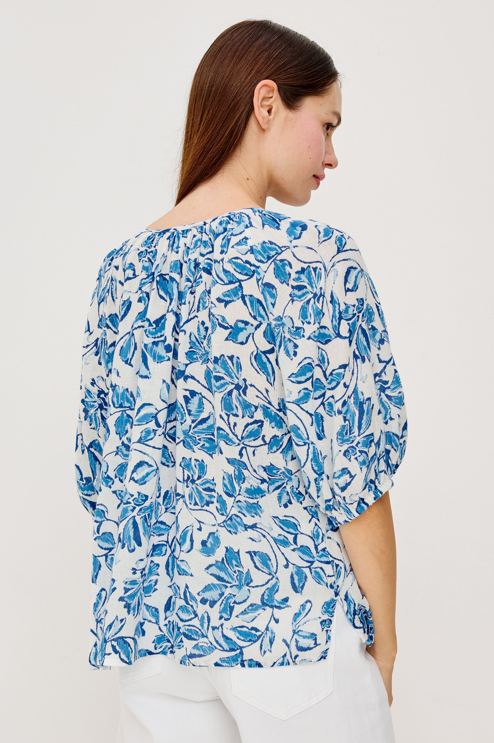 Kirstie Linen Top With Wide Scoop Neckline and Self-Ties Elbow-Length Raglan Sleeves With Elastic Cuffs and Loose Fit in Azure Jasmine Colorway - Upper Body Back View Featured on Model