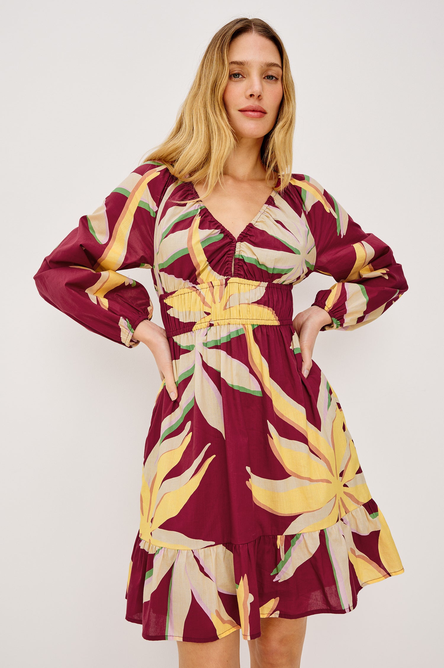 Krina Mini Dress in Cotton Poplin With Deep V-Neckline, Center Front Ties, Long Billowing Sleeves, and Tiered Hem in Red Palma Colorway - Upper Body Front View Featured on Model