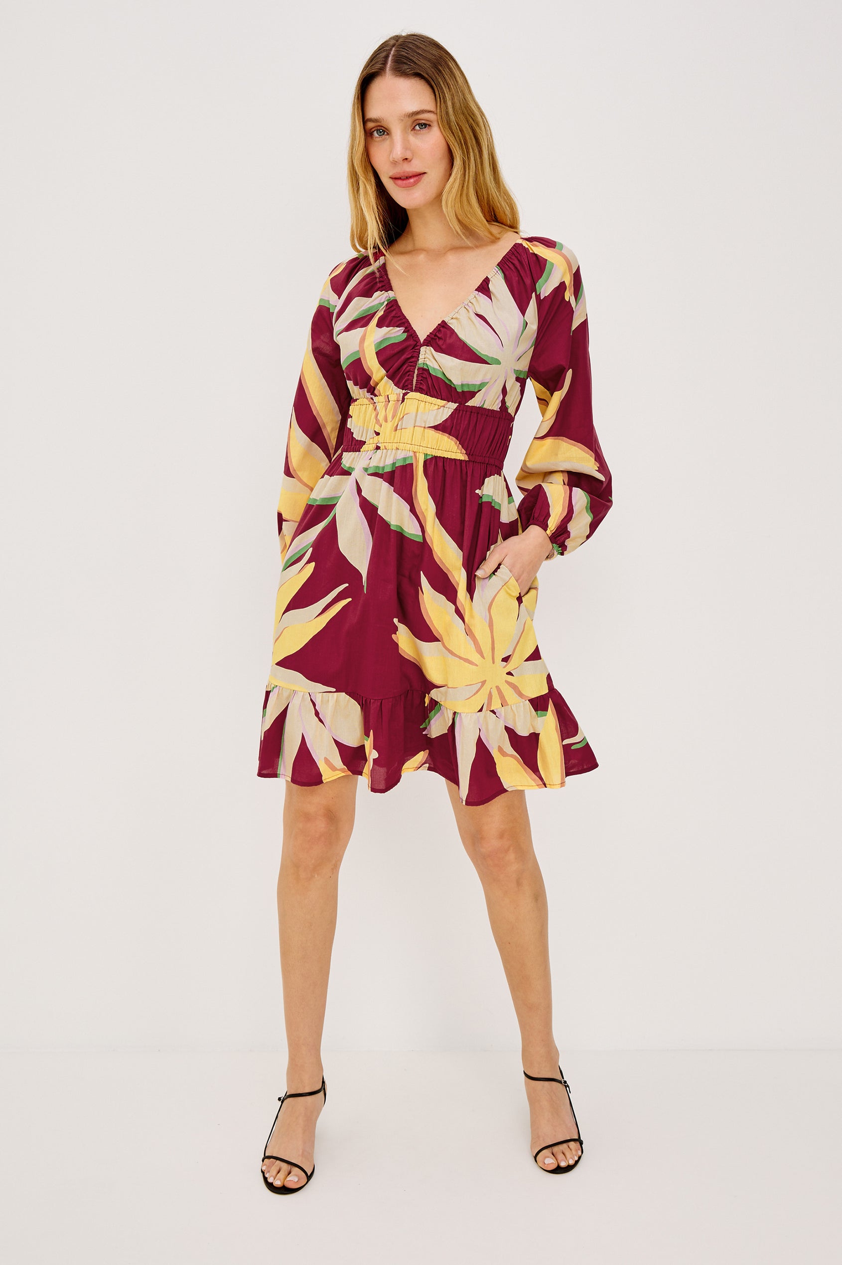 Krina Mini Dress in Cotton Poplin With Deep V-Neckline, Center Front Ties, Long Billowing Sleeves, and Tiered Hem in Red Palma Colorway - Full Body Front View Featured on Model