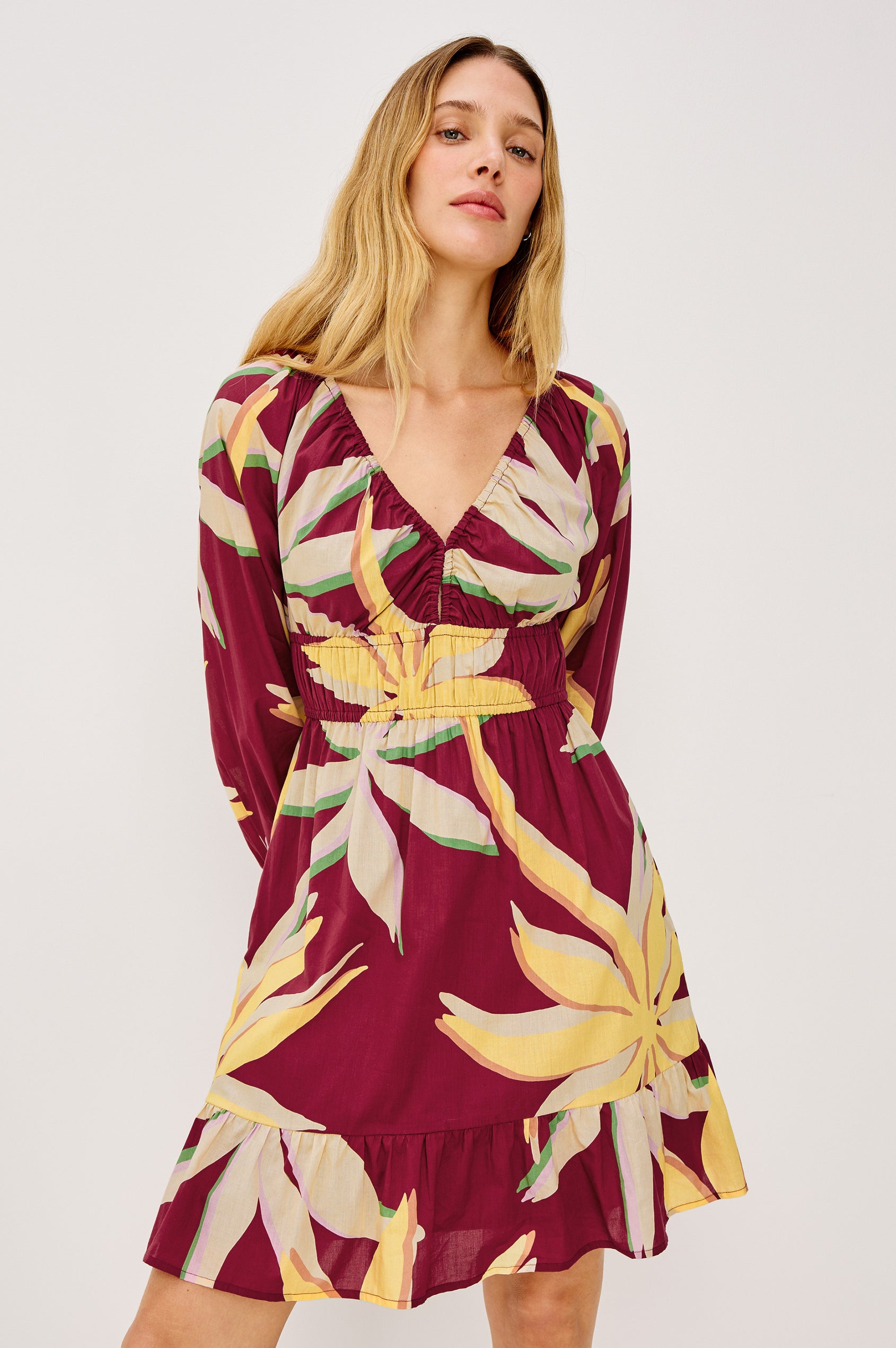 Krina Mini Dress in Cotton Poplin With Deep V-Neckline, Center Front Ties, Long Billowing Sleeves, and Tiered Hem in Red Palma Colorway - Upper Body Front View Featured on Model