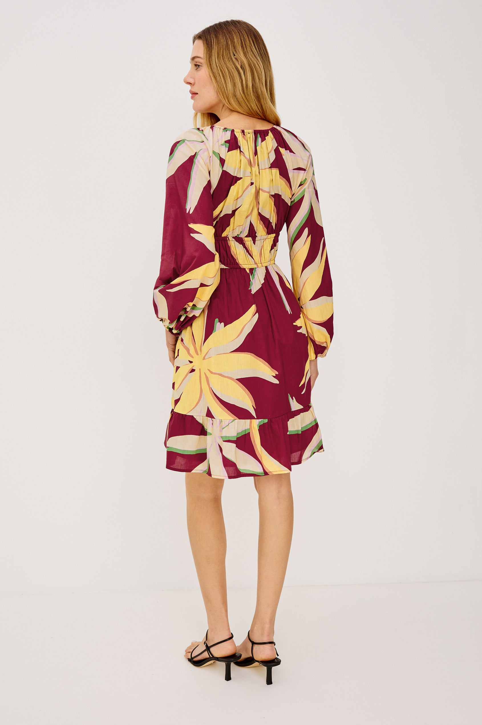 Krina Mini Dress in Cotton Poplin With Deep V-Neckline, Center Front Ties, Long Billowing Sleeves, and Tiered Hem in Red Palma Colorway - Full Body Back View Featured on Model