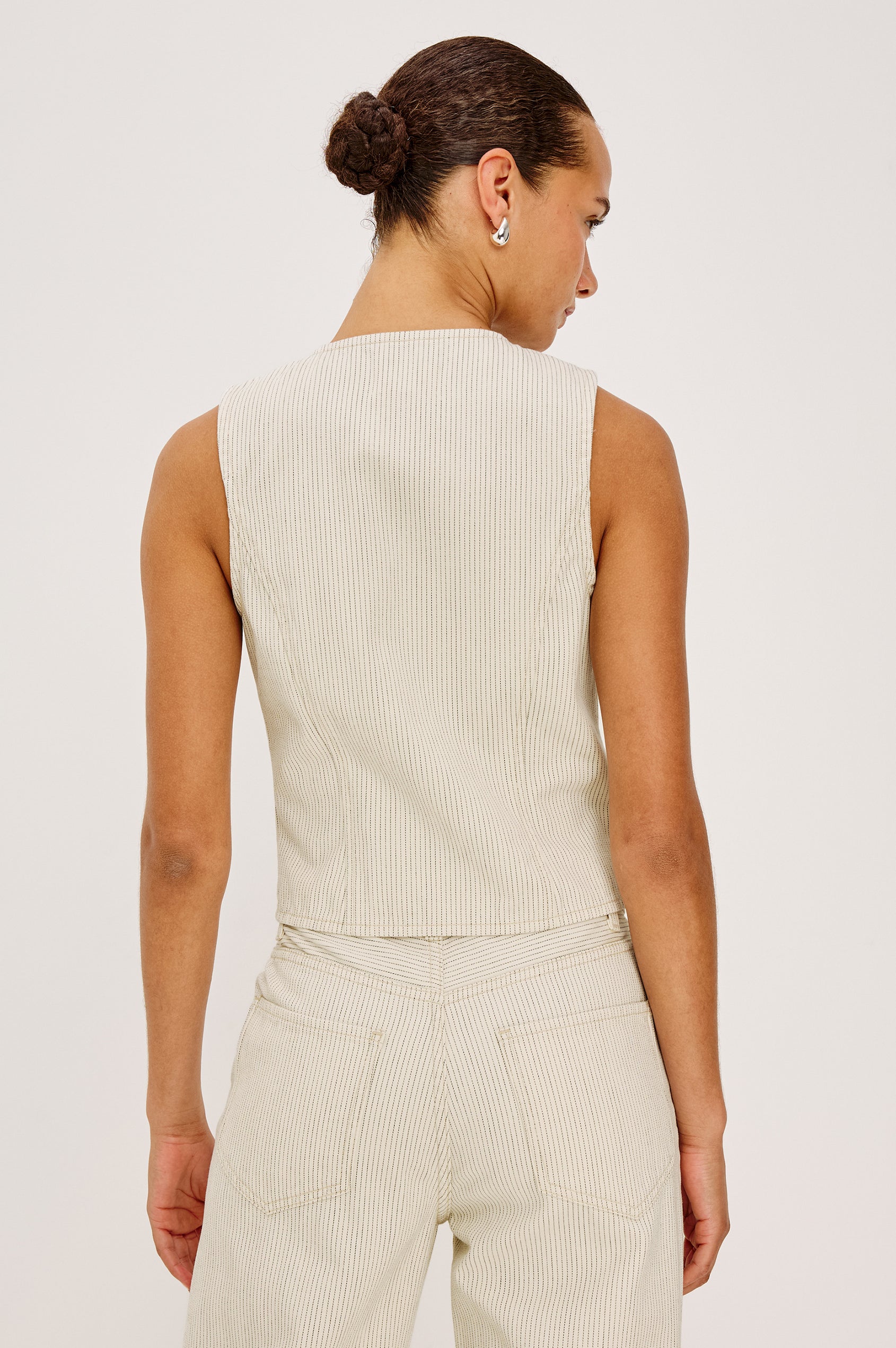 La Jolla Vest With V-Neck, Front Buttons, and Sleeveless Cut in Ecru Railroad Stripe Colorway - Upper Body Back View Featured on Model