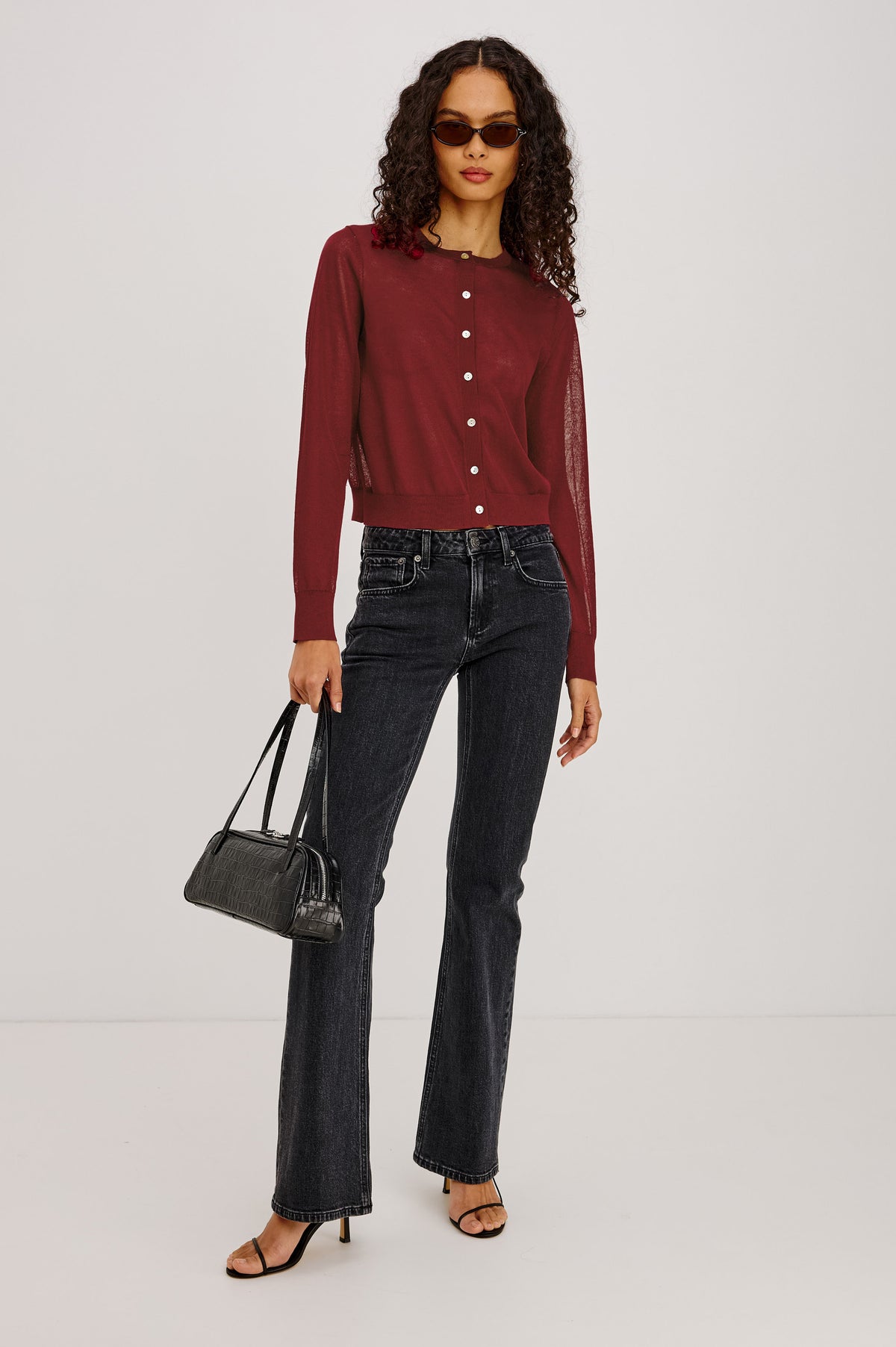 Lakelyn Cardigan in Sheer Fine-Gauge Knit With Slightly Cropped, Boxy Fit, Crew Neck, Front Button Closures, and Long Sleeves in Crimson Colorway - Full Body Front View Featured on Model