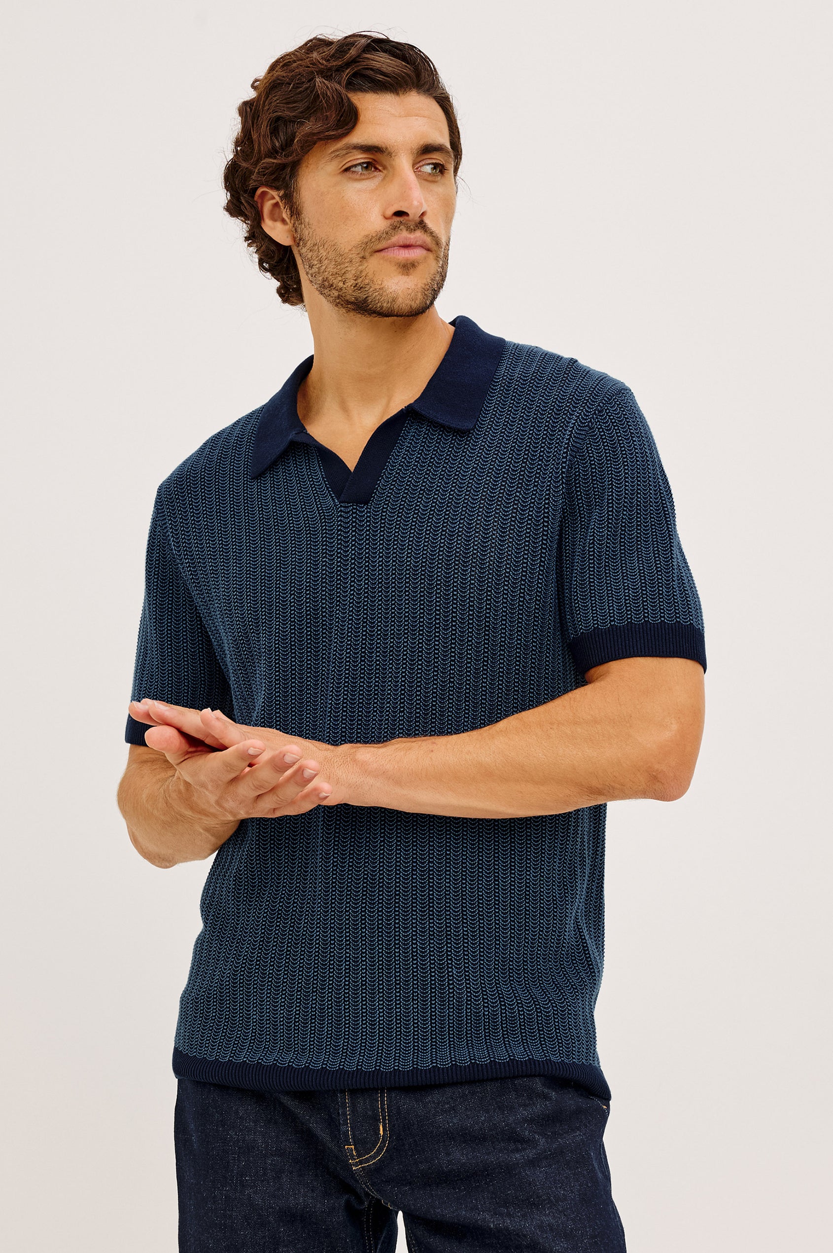 Langley Polo Shirt in Lightweight Contrast Open Birdseye Knit With Classic Fit, Open Collar, Short Sleeves, and Ribbed Trim in Navy Marine Ripple Colorway - Upper Body Front View Featured on Model