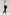 The Larchmont Onyx High Rise Skinny Pants - full front body feet crossed