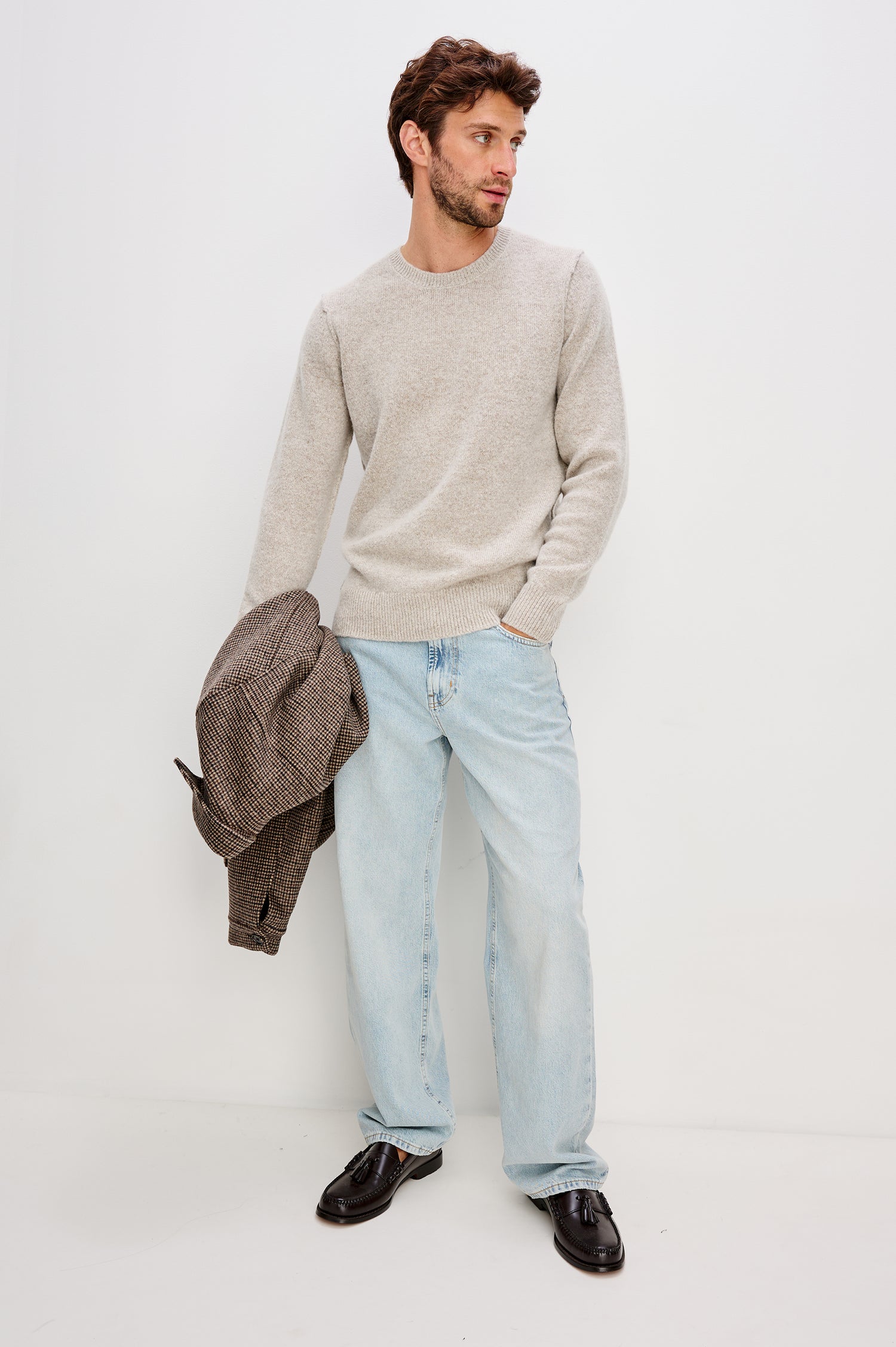 Laurent is a relaxed-fit crewneck sweater, dropped shoulders, long sleeves, and linking-stitch detailing at the shoulders in Silverleaf colorway. Front full body view featured on model.