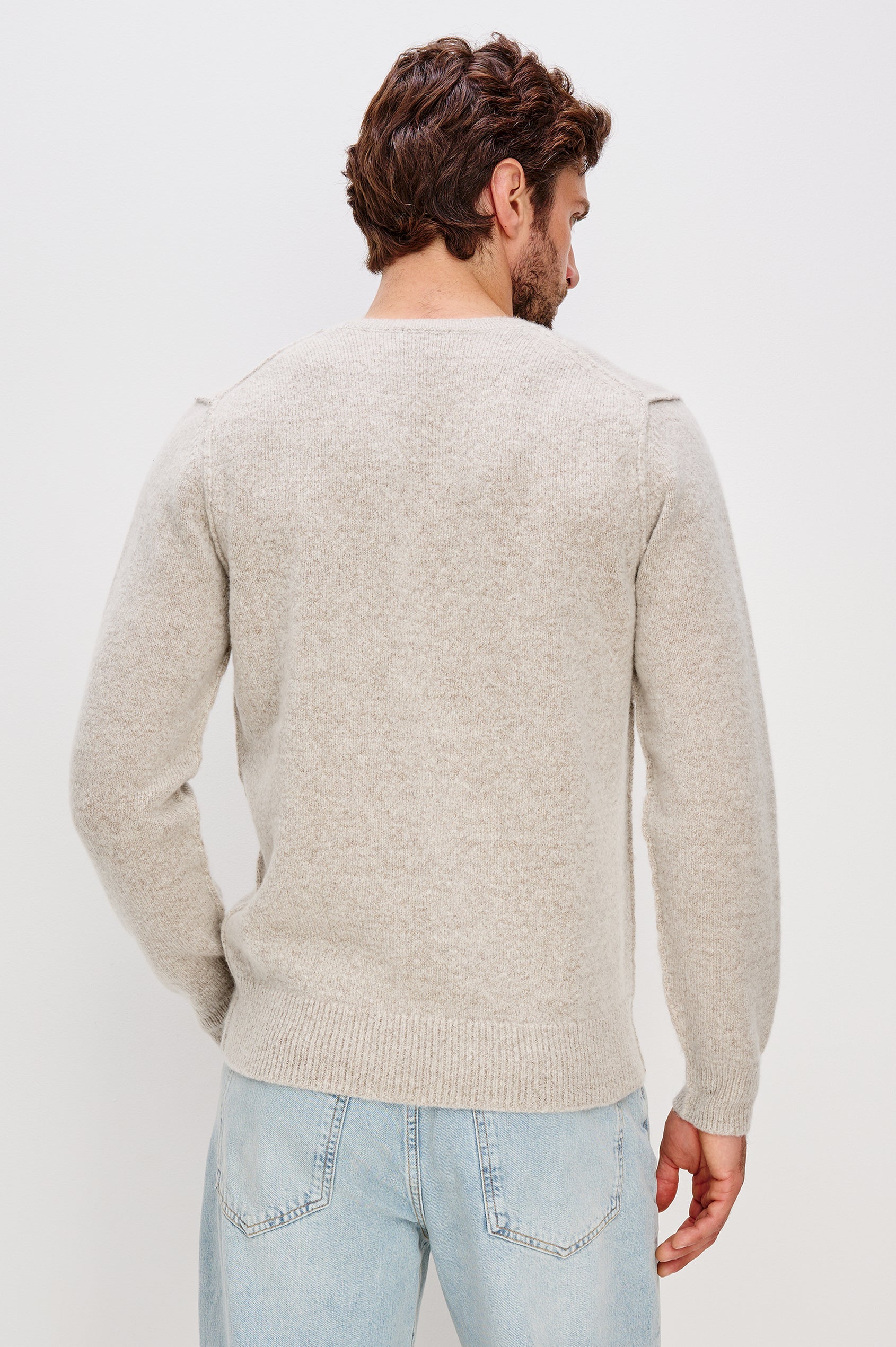 Laurent Crewneck Sweater in Wool Blend With Dropped Shoulders With Linking Stitch Detailing and Long Sleeves in Silverleaf Colorway - Upper Body Back View Featured on Model