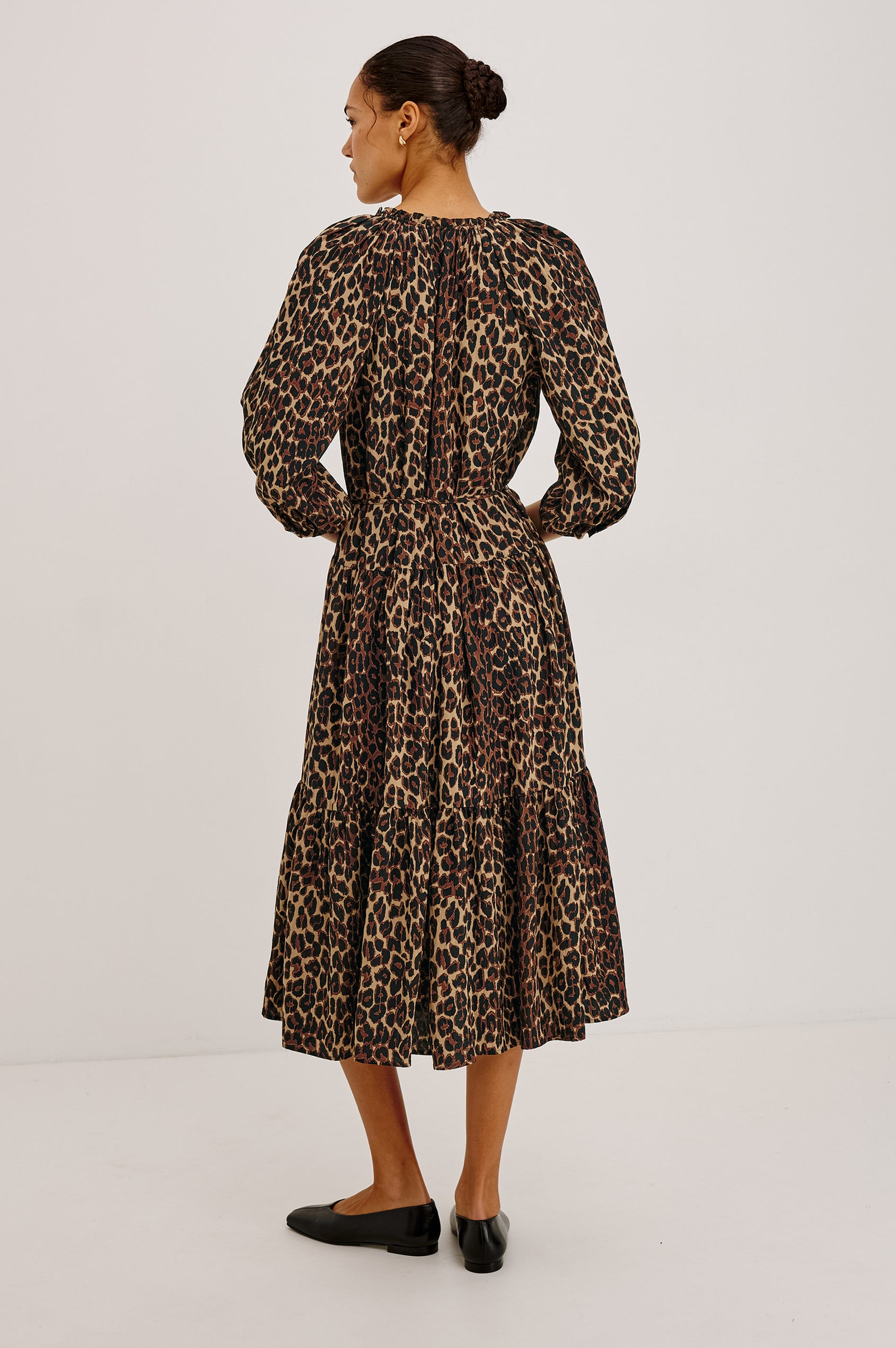 Leanne Maxi Dress in Crinkle Poplin With Loose Swing Fit, Ruffle Trim Peasant Neckline, Long Balloon Sleeves, Front Buttons, and Single Tier in Brown Nala Colorway - Full Body Back View Featured on Model