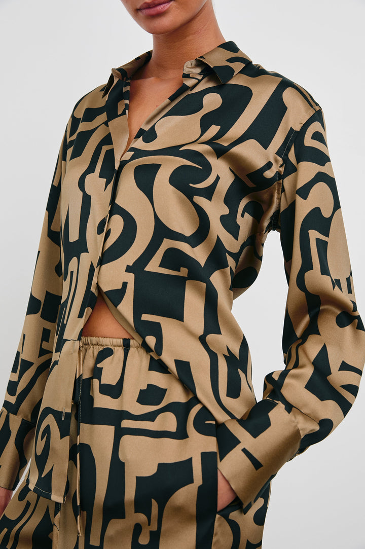 Ledger Long-Sleeve Button Down in Santorini Sand Colorway, a black and sand-colored design - Front View Featured on Model