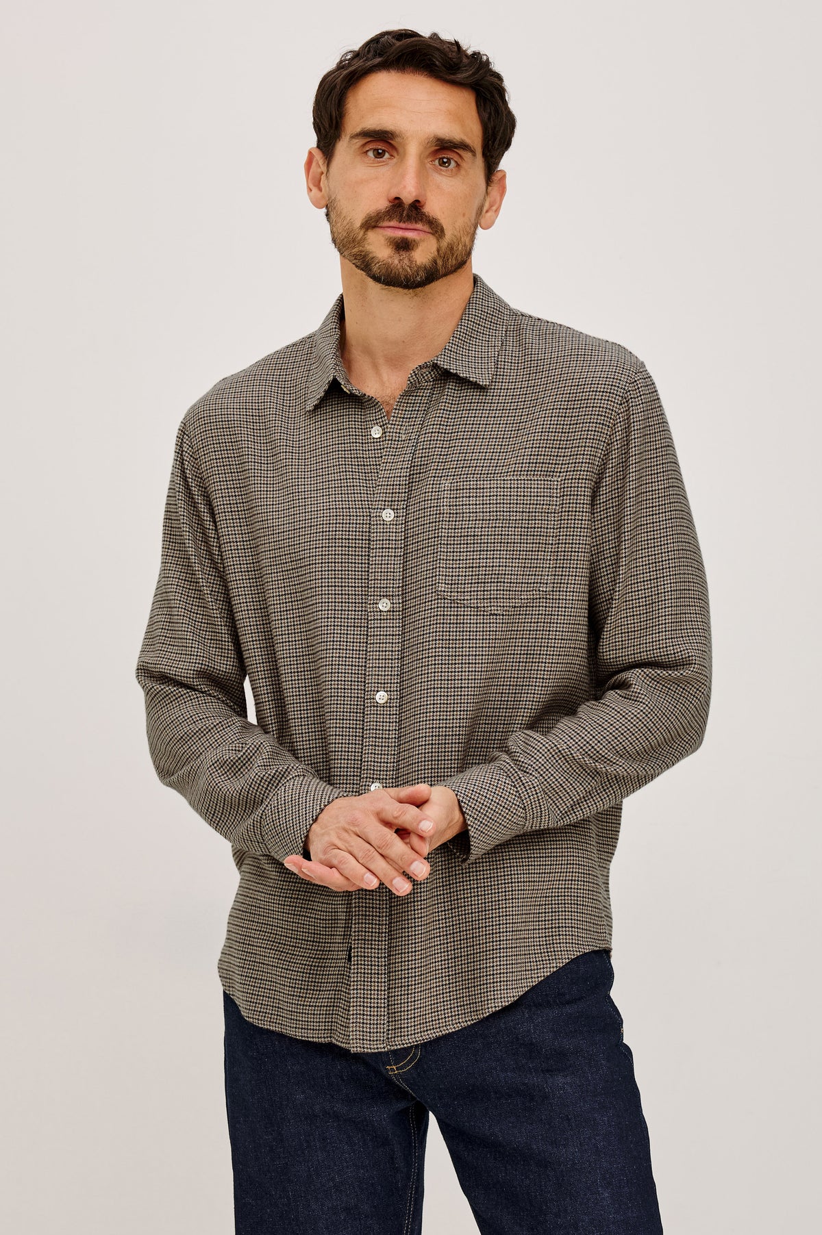 Lennox Shirt in Houndstooth Cotton-Rayon Blend With Front Buttons, Single Chest Pocket, Point Collar, and Long Sleeves in Cotswold Houndstooth Colorway - Upper Body Front View Featured on Model.