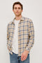 Lennox Long-Sleeve Button Up with a Chest Patch Pocket in Palamino Skyline Melange Colorway, a plaid in Palamino, Skyline and White - Front View Featured on Model