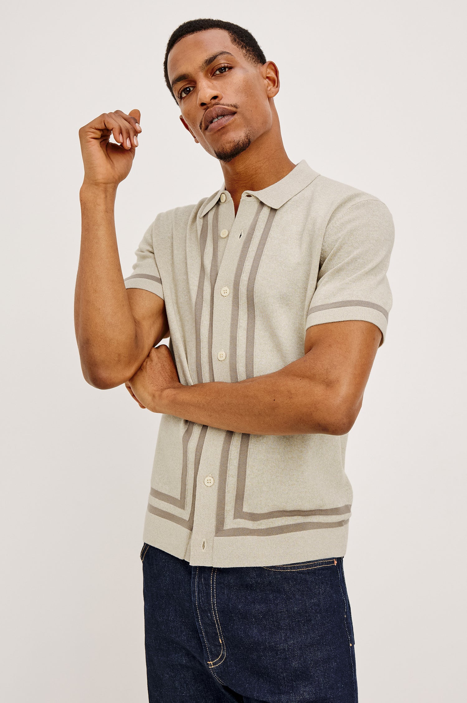 Leo Knit Sweater Polo in Yarn-Dyed Cotton Blend With Collar, Front Buttons, and Short Sleeves in Driftwood Melange Colorway - Front View Featured on Model