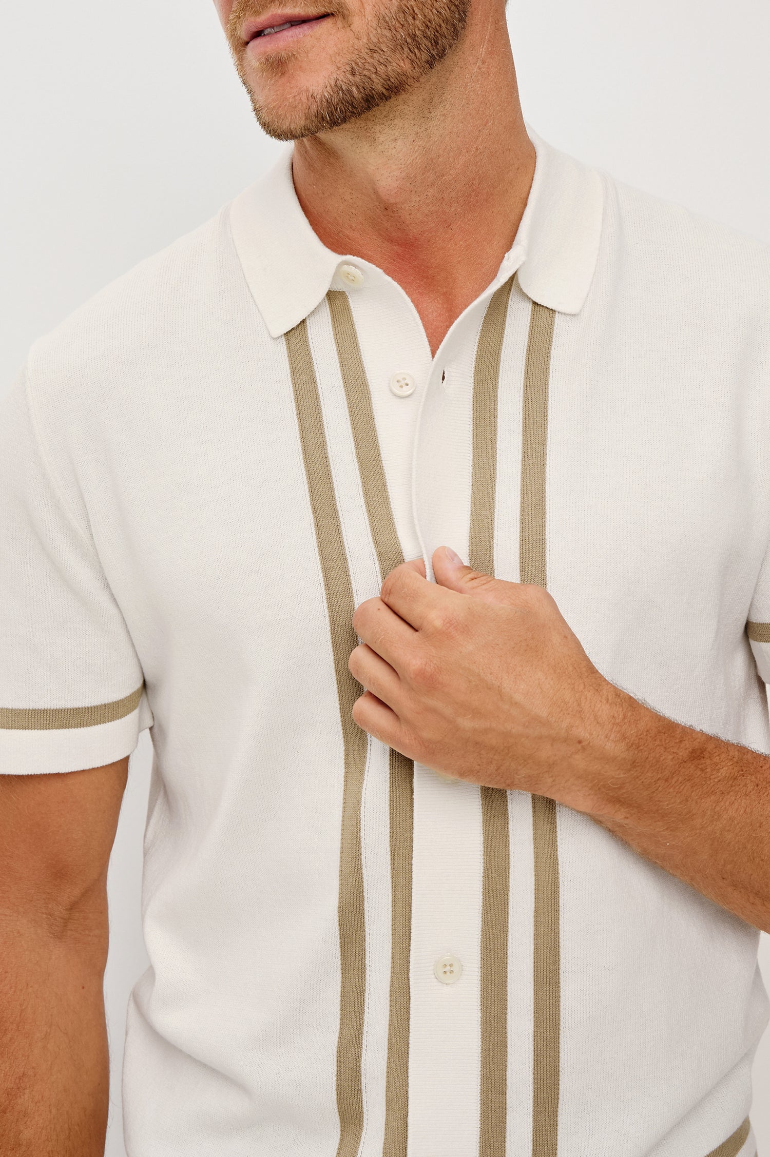 Leo Knit Sweater Polo in Yarn-Dyed Cotton Blend With Collar, Front Buttons, and Short Sleeves in White Cashew Colorway - Upper Body Close Up Front View Featured on Model