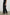 Leon Pant with a Smocked Waistband, Short Side Slits on Outer Leg and Two Front Seam Pockets in Black Colorway - Side View Featured on Model