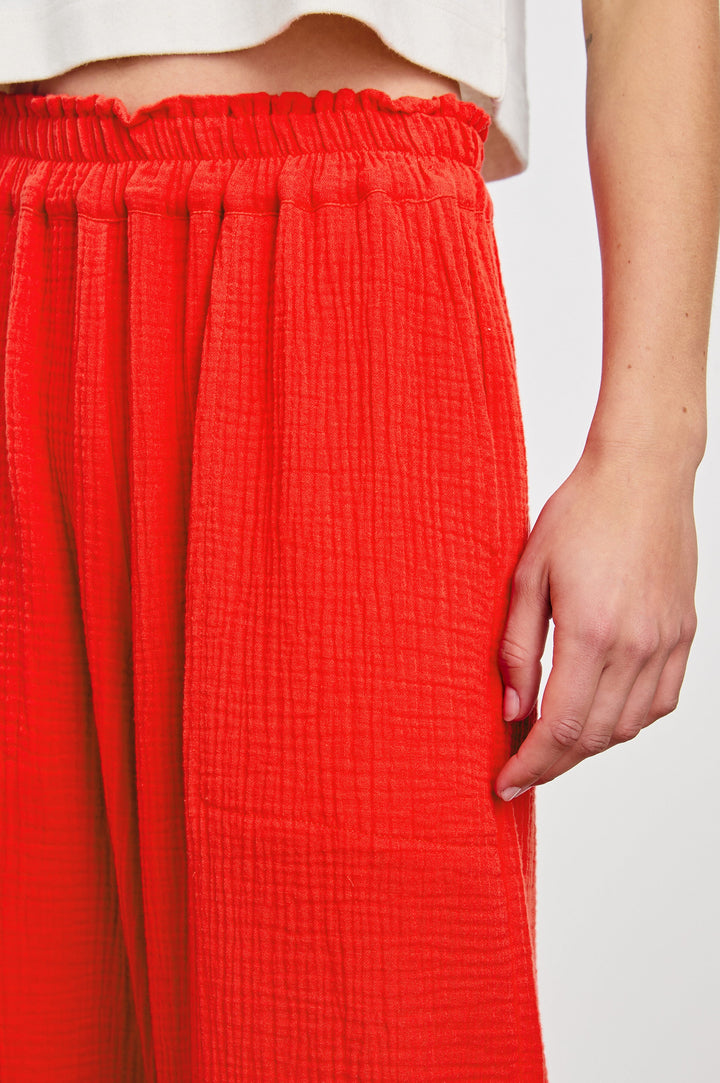 Leon Crop Pant with a Smocked Waistband and Two Front Seam Pockets in Cherry Colorway - Front View Featured on Model