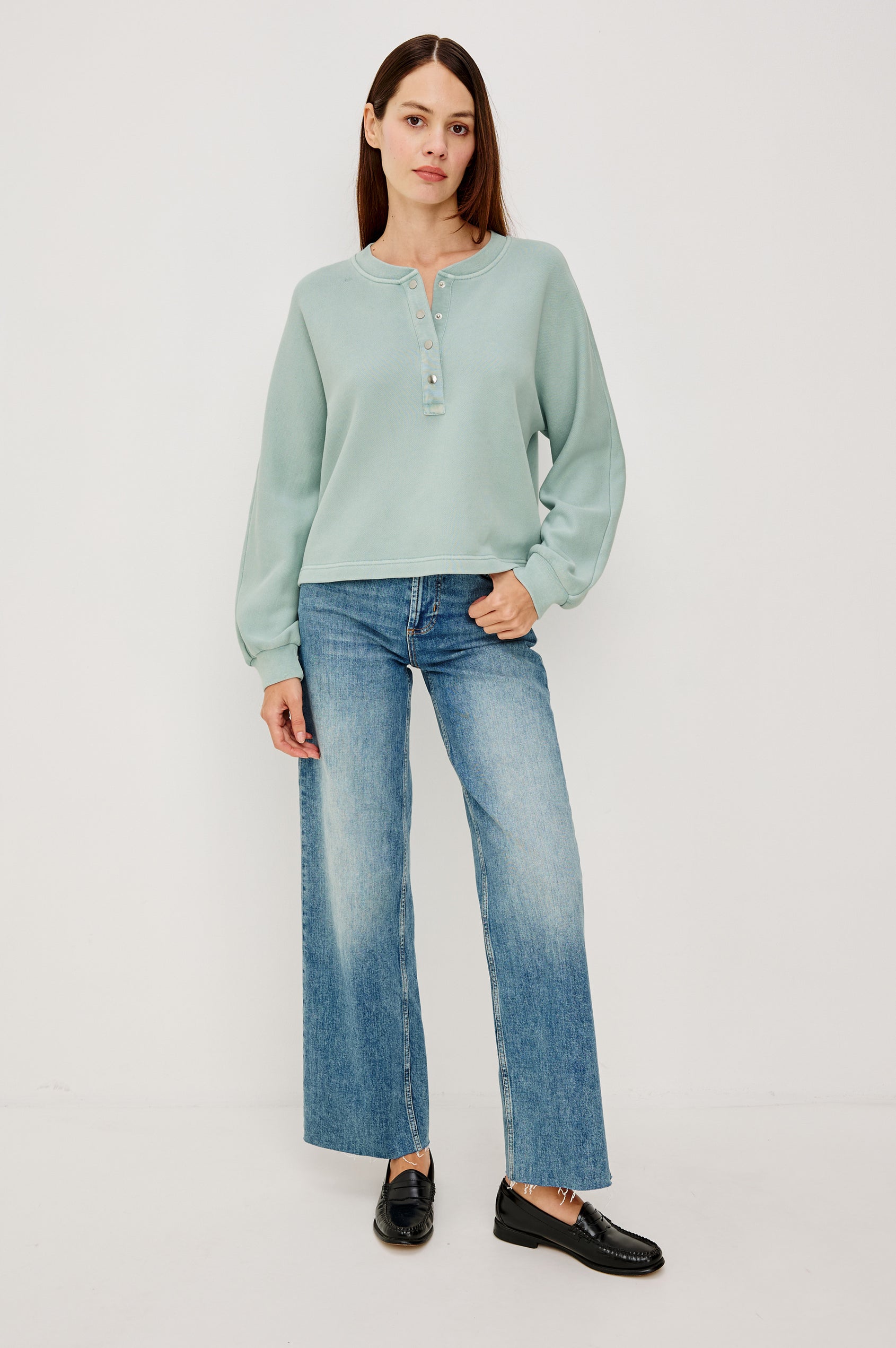 Leonie Sweatshirt in French Terry With Relaxed Boxt Fit, Snap Button Half Placket, Long Puff Sleeves, and Ribbed Neckline and Cuffs in After Midnight Colorway - Full Body Front View Featured on Model