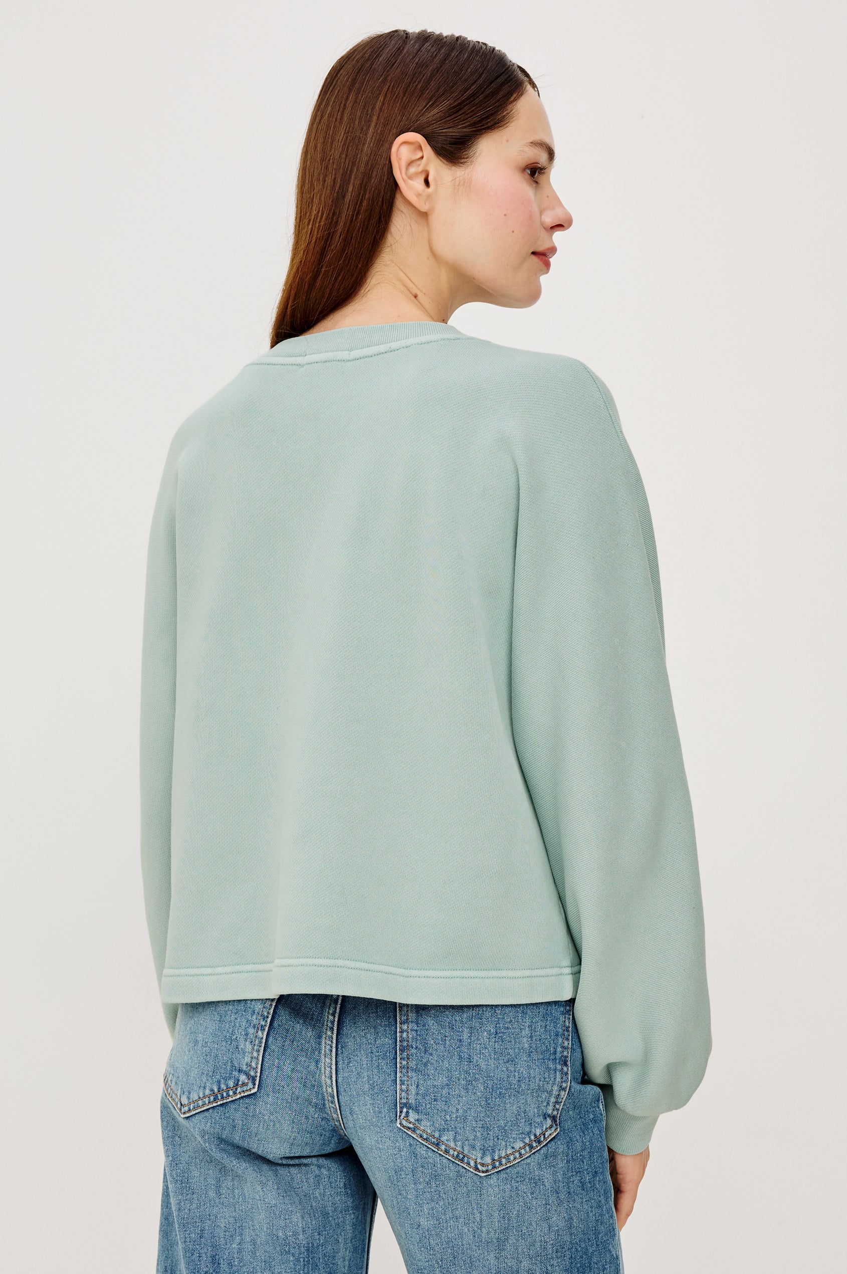 Leonie Sweatshirt in French Terry With Relaxed Boxt Fit, Snap Button Half Placket, Long Puff Sleeves, and Ribbed Neckline and Cuffs in After Midnight Colorway - Upper Body Back View Featured on Model