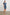 Letta Above-Knee Dress with Flutter Sleeves, Snaps down the Front, and a Belted Waist in Classic Blue Colorway - Front Full Body View Featured on Model 