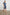 Letta Above-Knee Dress with Flutter Sleeves, Snaps down the Front, and a Belted Waist in Classic Blue Colorway - Front Full Body View Featured on Model 