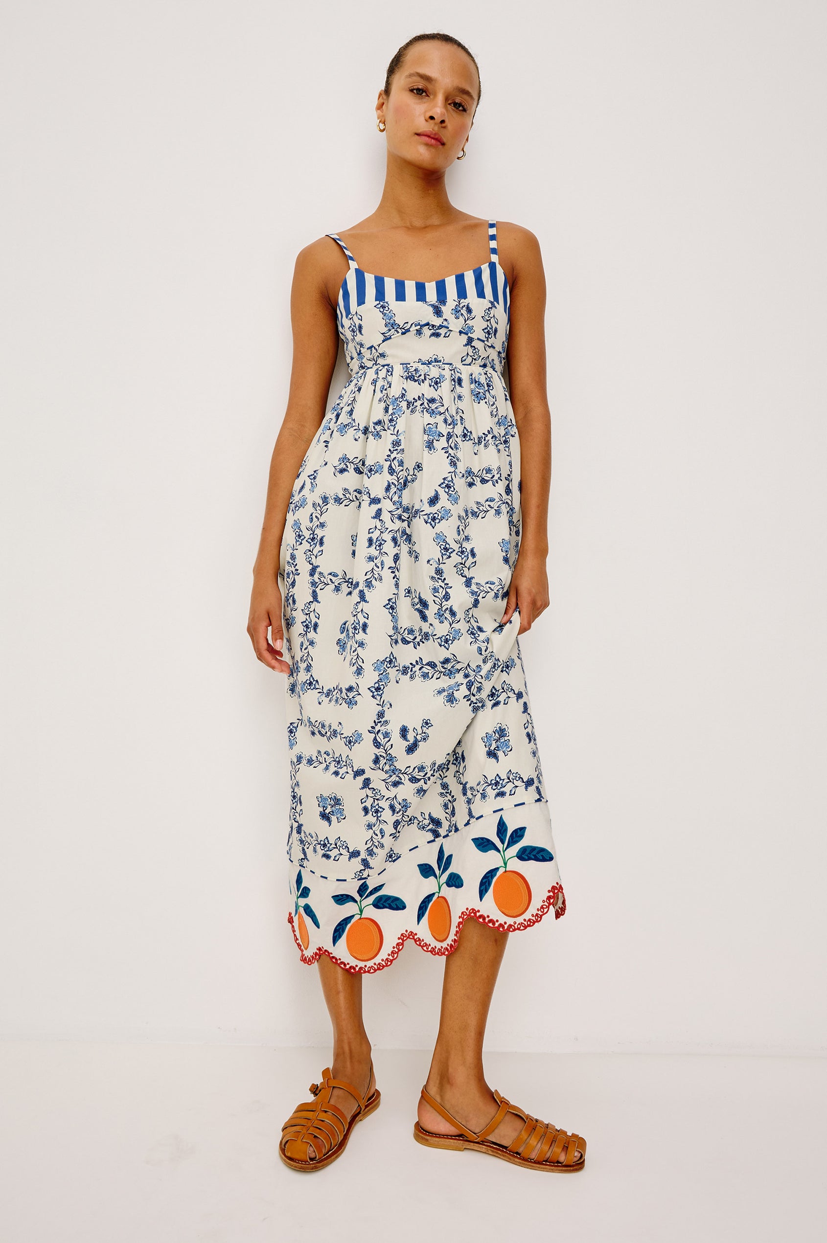 Lexie Maxi Dress in Cotton Poplin With Adjustable Shoulder Straps, Empire Waist, Piped Detailing, Orange Embroidery and Eyelet Hem, and is Fully Lined -