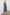 Lilith Sleeveless Midi Dress with Wide Shoulder Straps, a Deep V neck, a Cinched Waist with Drawstring, and a Back Neck Tie in Navy Flora Colorway, with flowers in creams and blues on Navy - Front Full Body View Featured on Model  