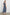 Lilith Sleeveless Midi Dress with Wide Shoulder Straps, a Deep V neck, a Cinched Waist with Drawstring, and a Back Neck Tie in Navy Flora Colorway, with flowers in creams and blues on Navy - Back Full Body View Featured on Model  